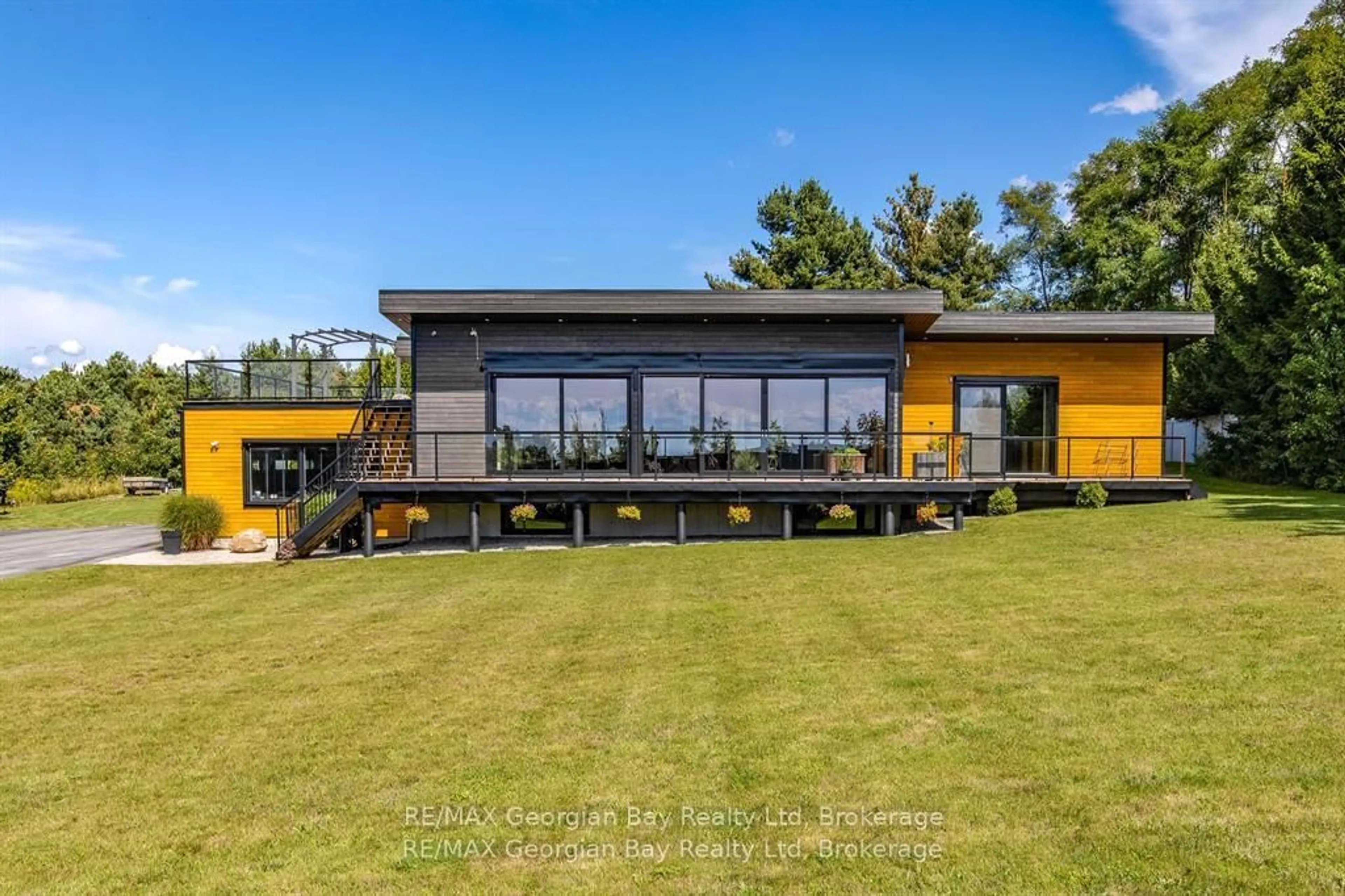 A pic from outside/outdoor area/front of a property/back of a property/a pic from drone, water/lake/river/ocean view for 165 Wilson Rd, Tiny Ontario L4R 4K4