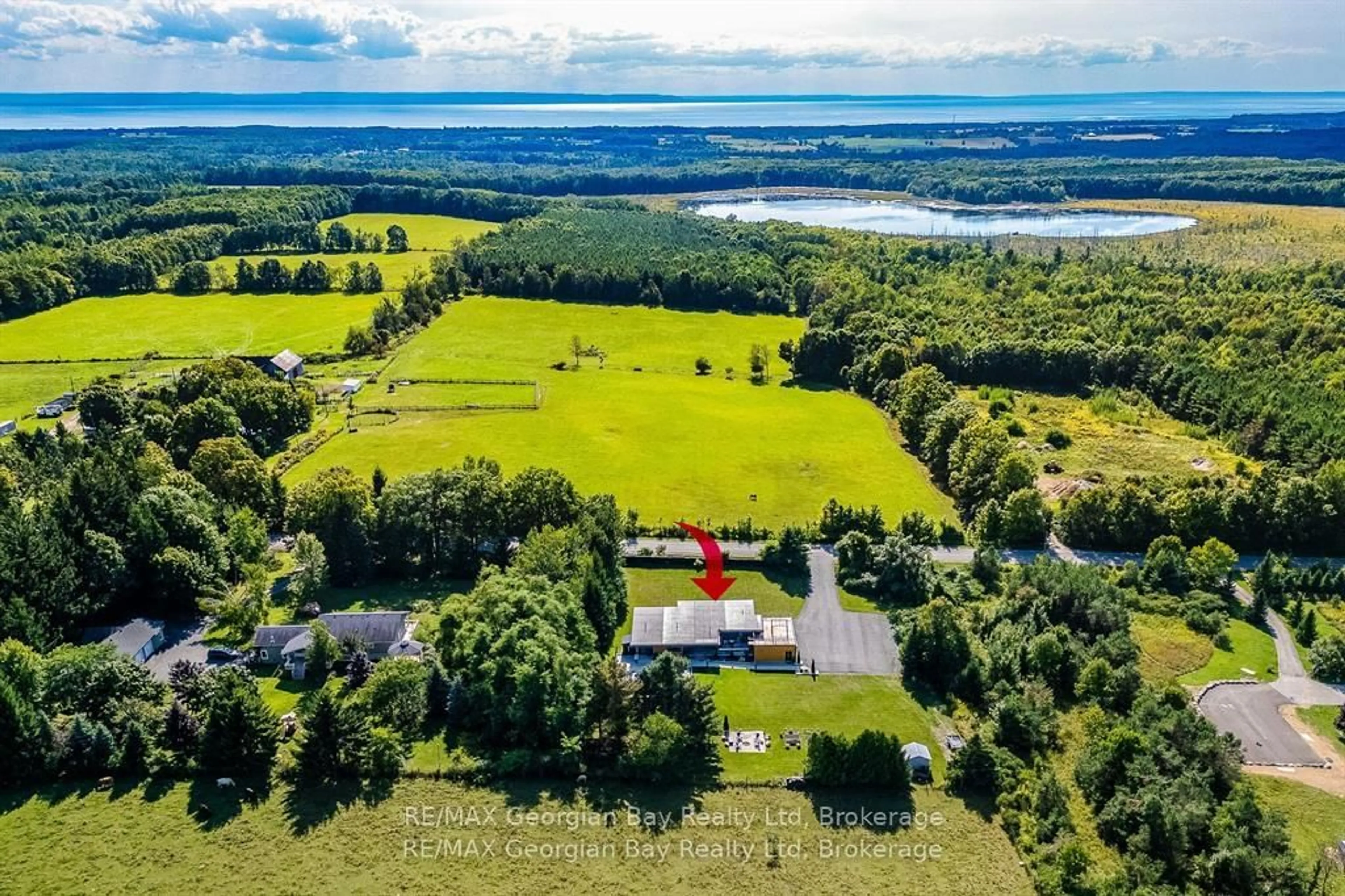 A pic from outside/outdoor area/front of a property/back of a property/a pic from drone, water/lake/river/ocean view for 165 Wilson Rd, Tiny Ontario L4R 4K4
