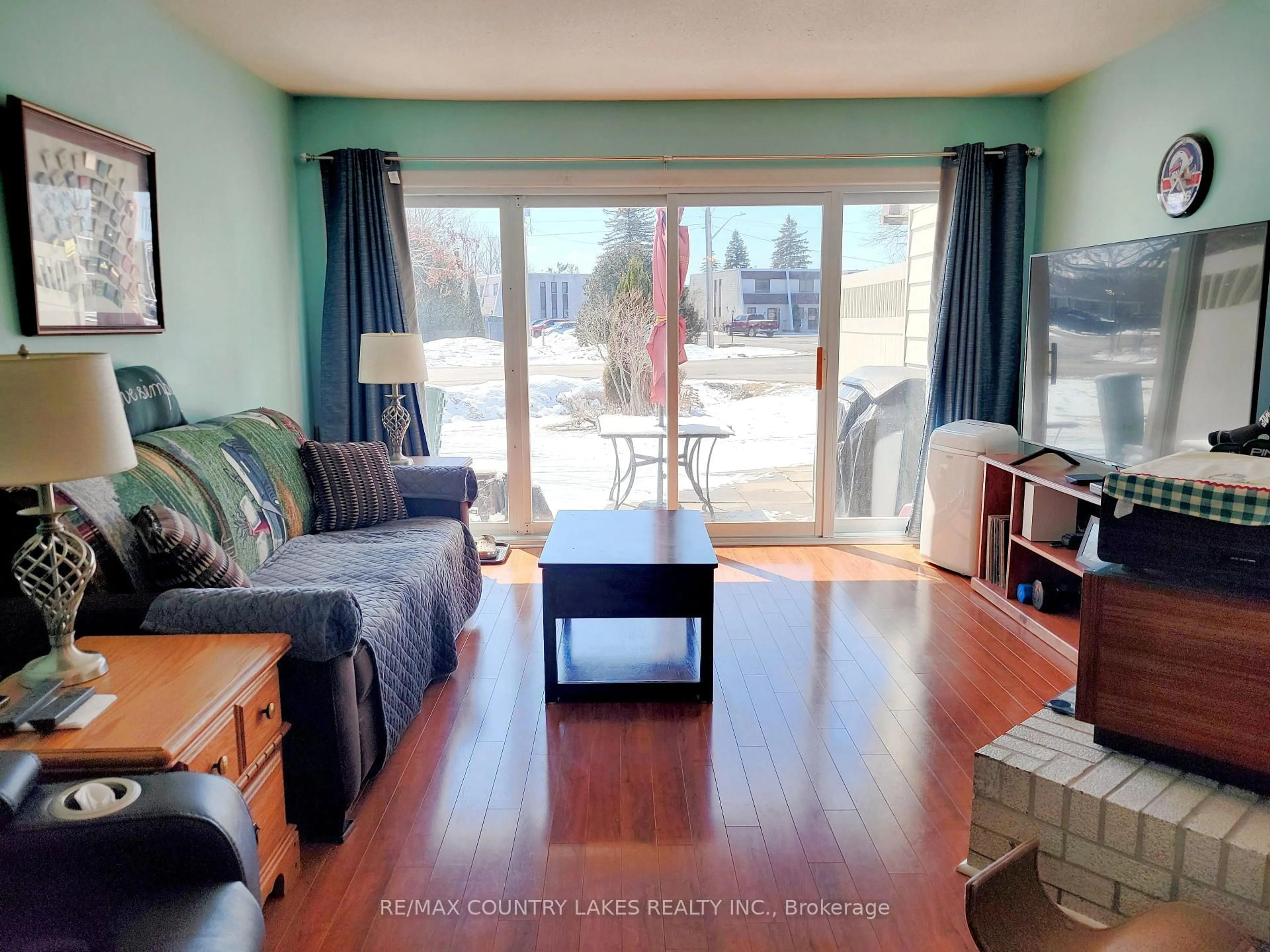 Living room with furniture, wood/laminate floor for 4 Paradise BLVD Blvd #3, Ramara Ontario L0K 1B0