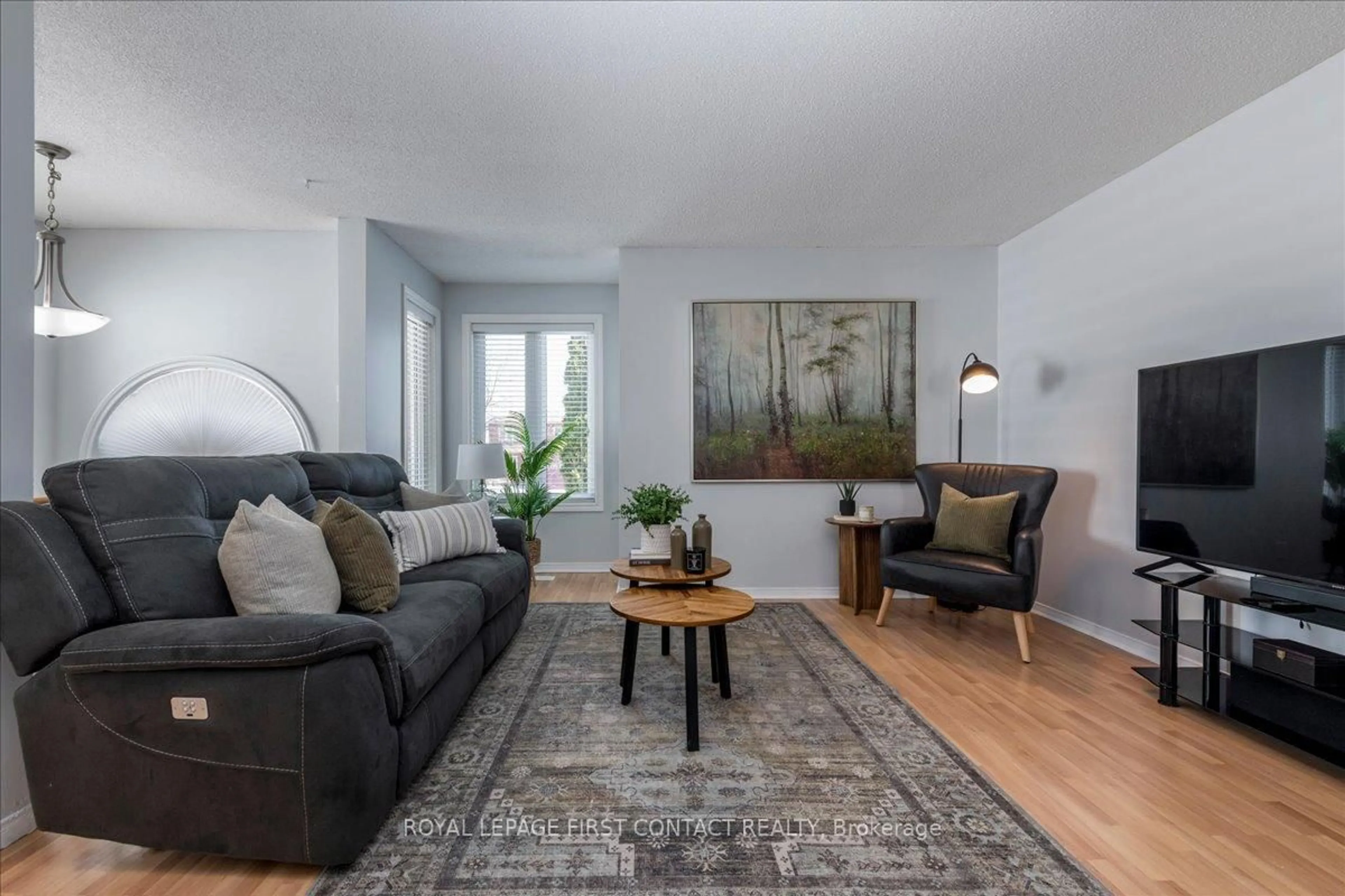 Living room with furniture, wood/laminate floor for 36 CHURCHLAND Dr, Barrie Ontario L4N 8P9