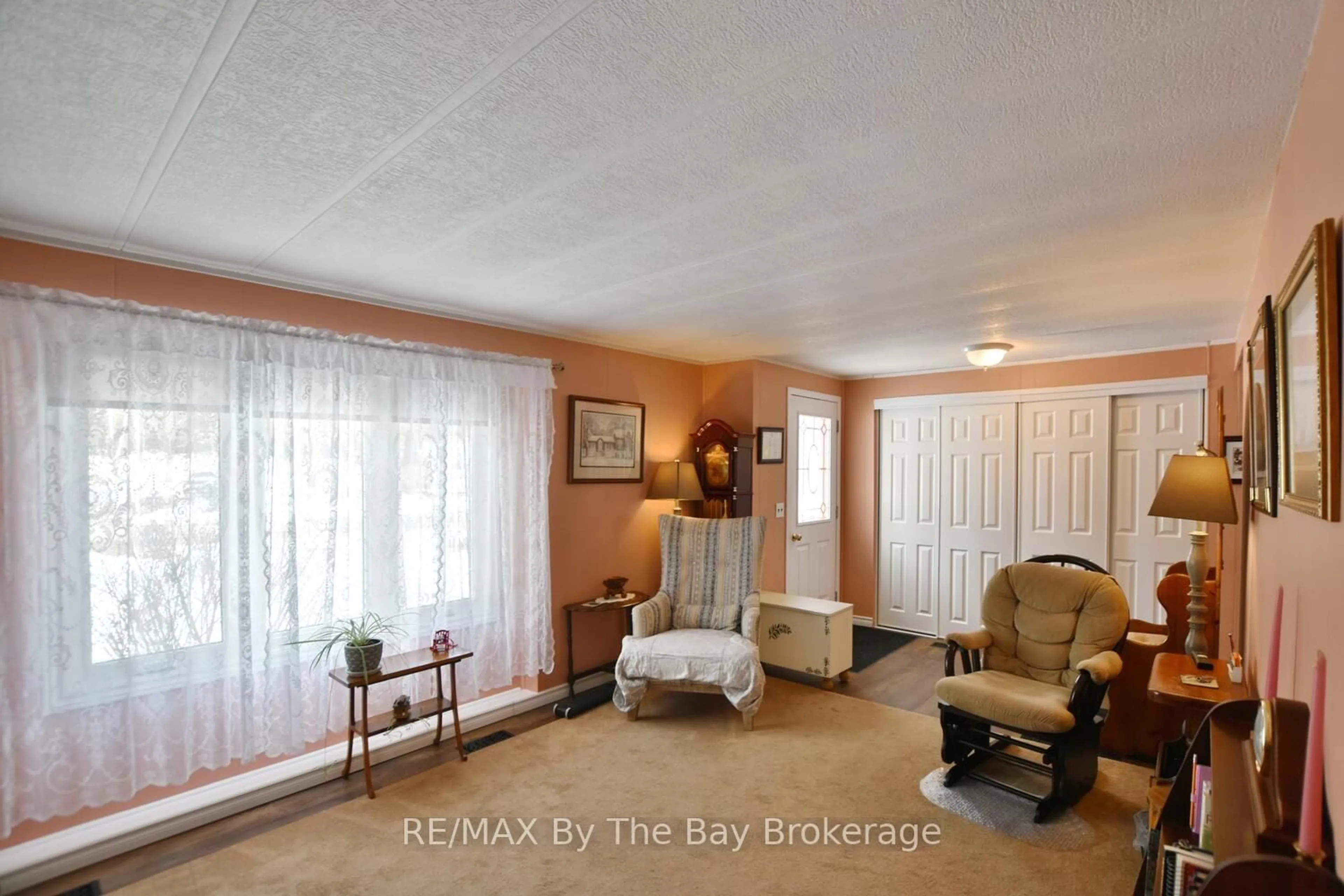 Living room with furniture, unknown for 1 Golf Ave, Wasaga Beach Ontario L9Z 1K2