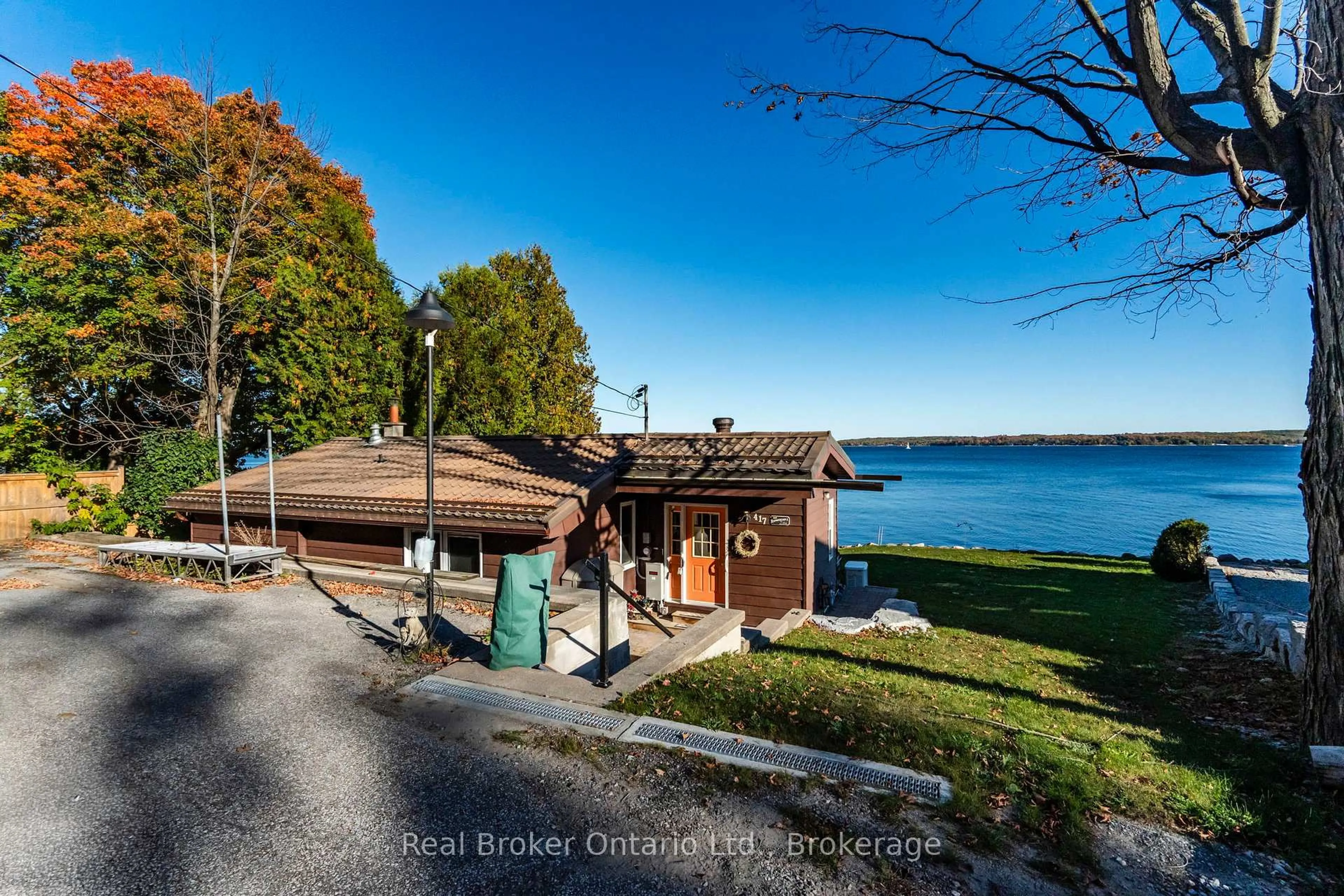 A pic from outside/outdoor area/front of a property/back of a property/a pic from drone, water/lake/river/ocean view for 417 Pheasant Lane, Midland Ontario L4R 5H3