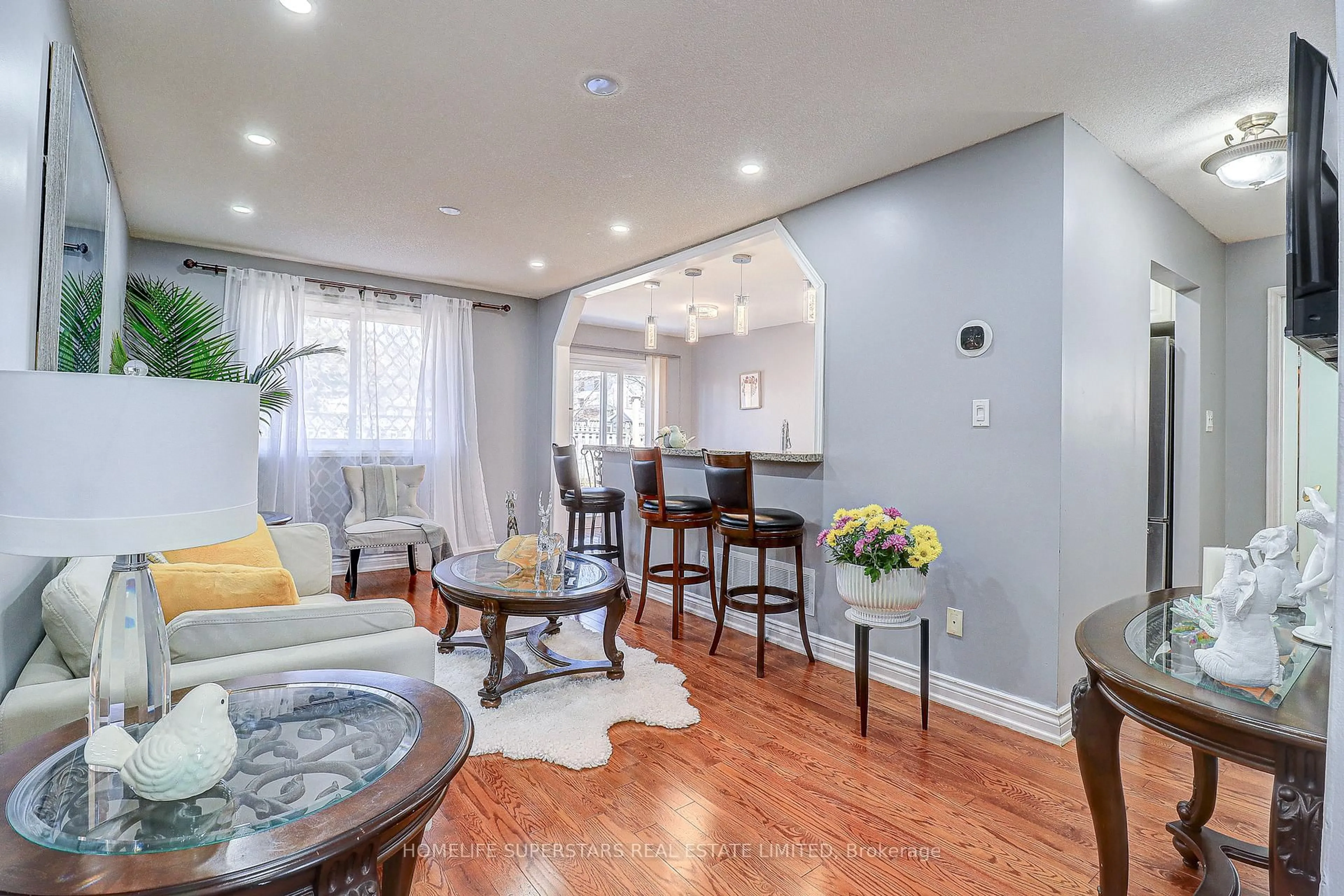 Living room with furniture, wood/laminate floor for 191 Wessenger Dr, Barrie Ontario L4N 8N9