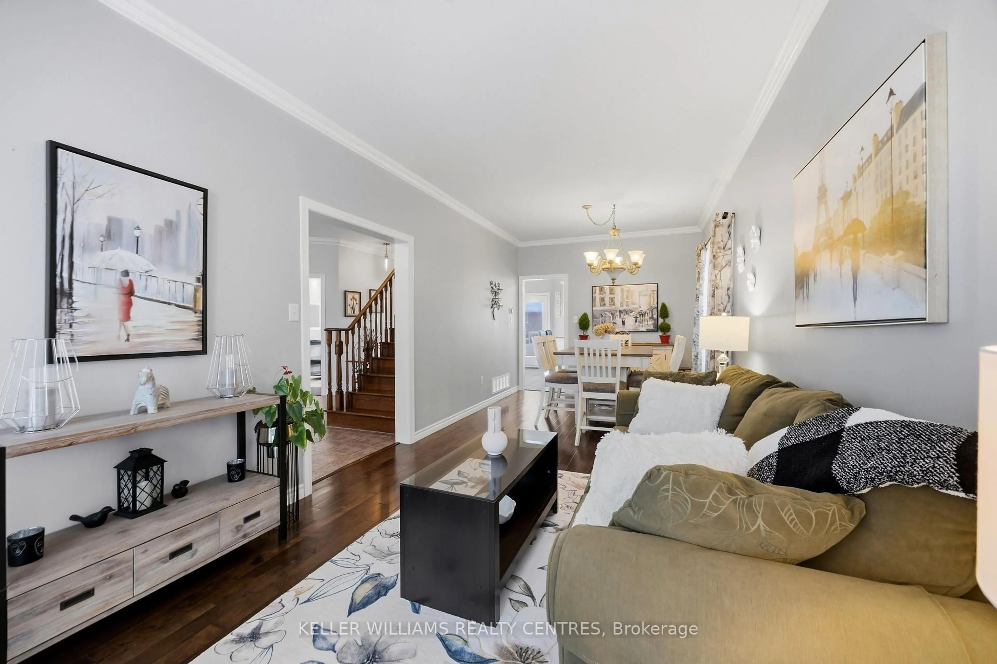 Living room with furniture, wood/laminate floor for 13 Surrey Dr, Barrie Ontario L4M 0C5