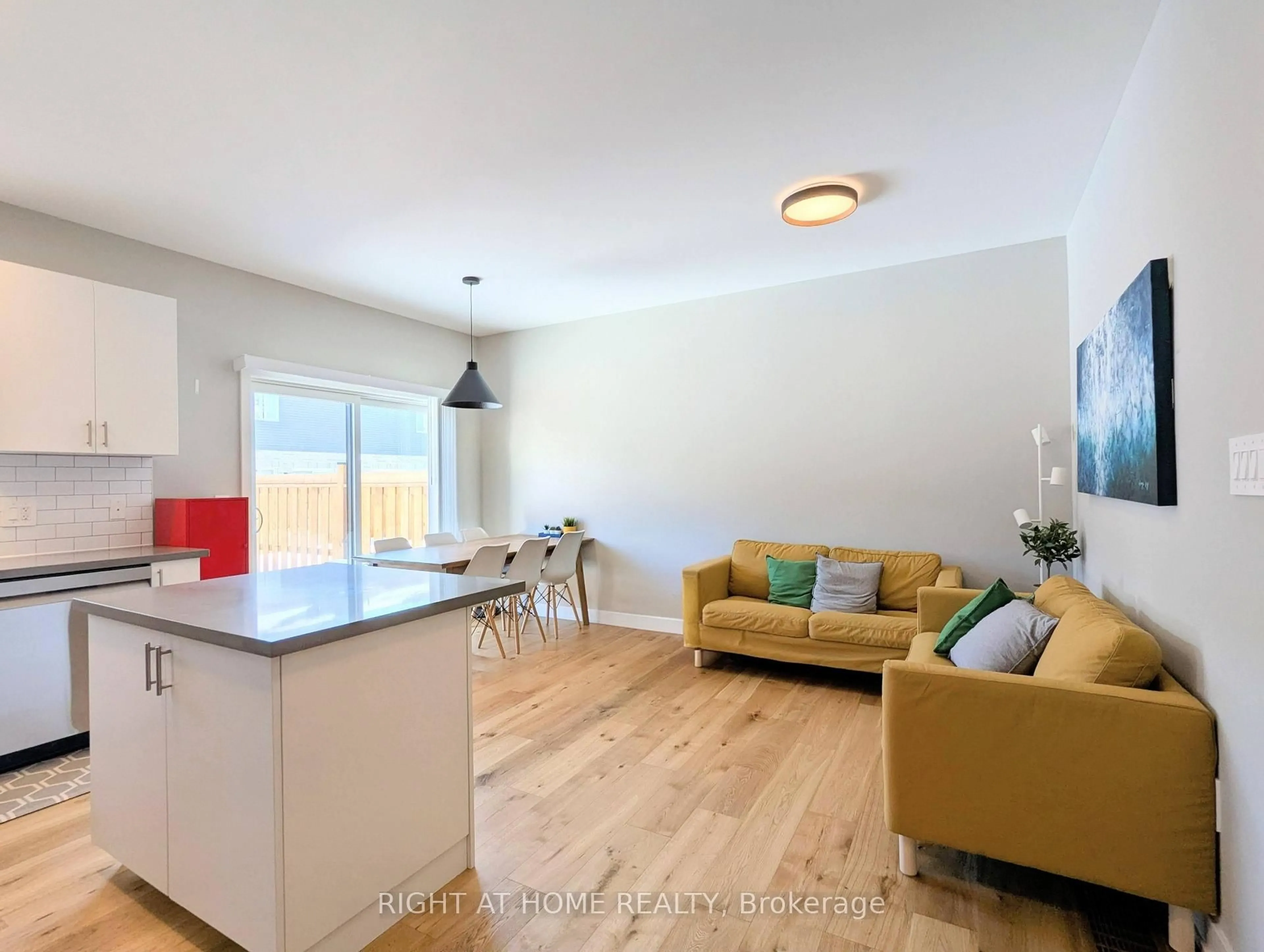 Open concept kitchen, wood/laminate floor for 22 Westwood Ave, Barrie Ontario L9J 0M6