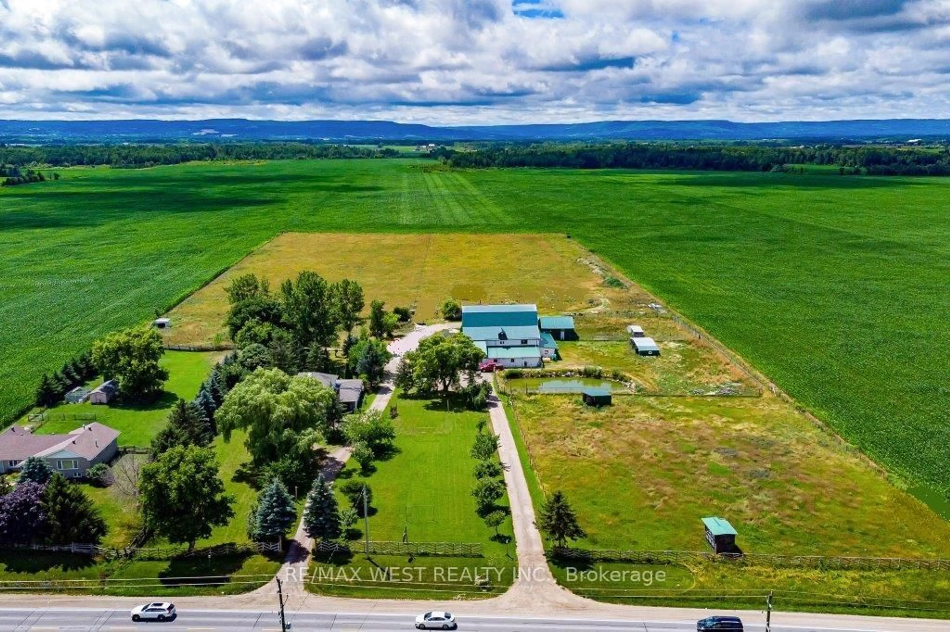 A pic from outside/outdoor area/front of a property/back of a property/a pic from drone, mountain view for 7941 Highway 26, Clearview Ontario L0M 1S0