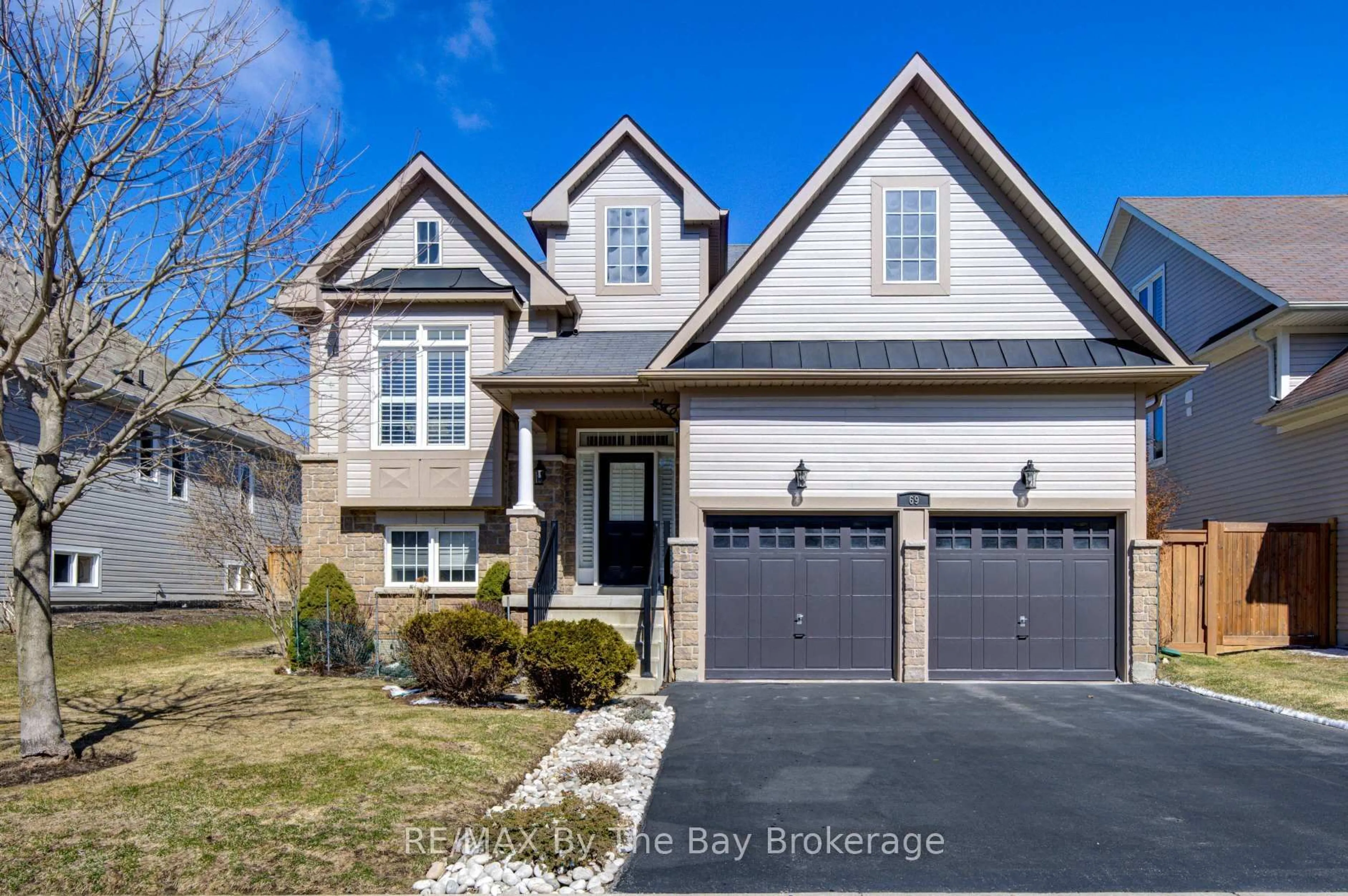 Home with brick exterior material, street for 69 White Sands Way, Wasaga Beach Ontario L9Z 0E1