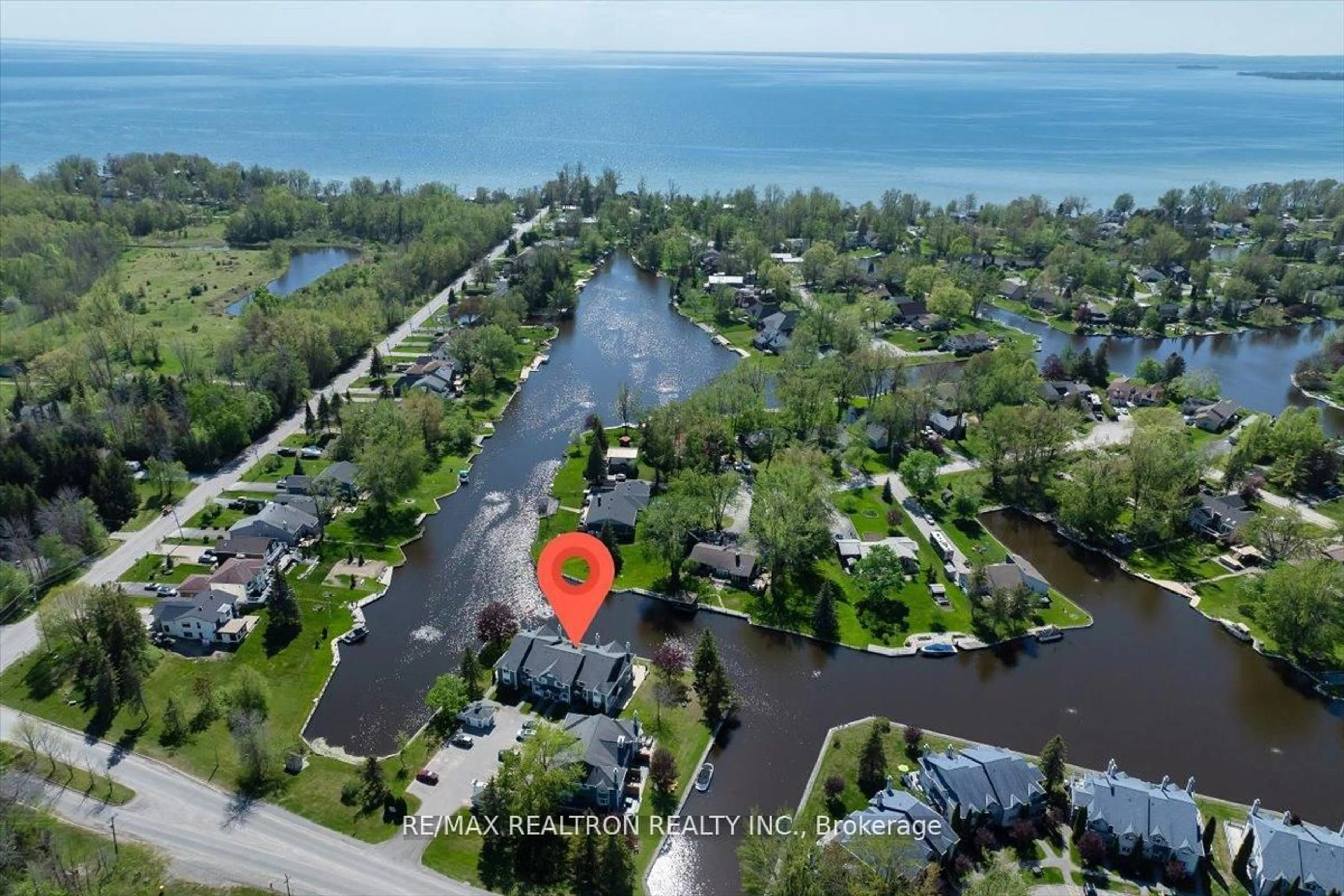 A pic from outside/outdoor area/front of a property/back of a property/a pic from drone, water/lake/river/ocean view for 2 Laguna Pkwy #4, Ramara Ontario L0K 1B0