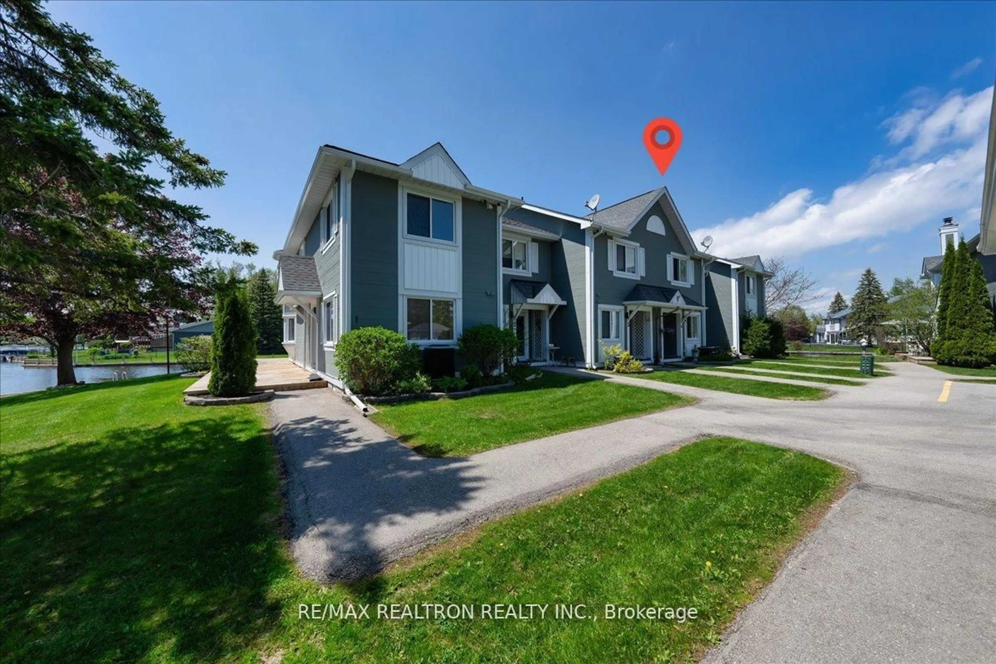 A pic from outside/outdoor area/front of a property/back of a property/a pic from drone, street for 2 Laguna Pkwy #4, Ramara Ontario L0K 1B0