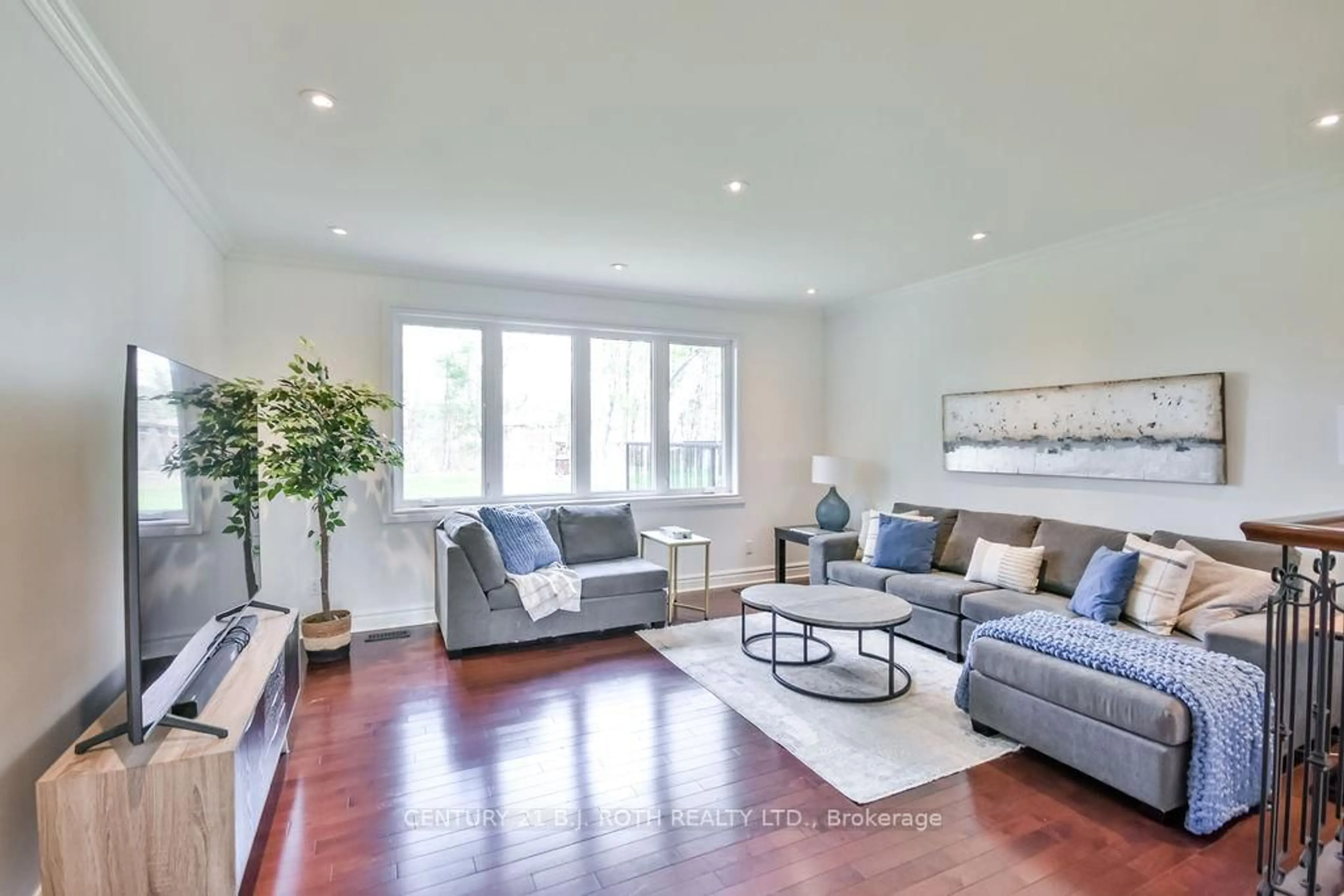 Living room with furniture, wood/laminate floor for 12 Noraline Ave, Springwater Ontario L0L 1X1