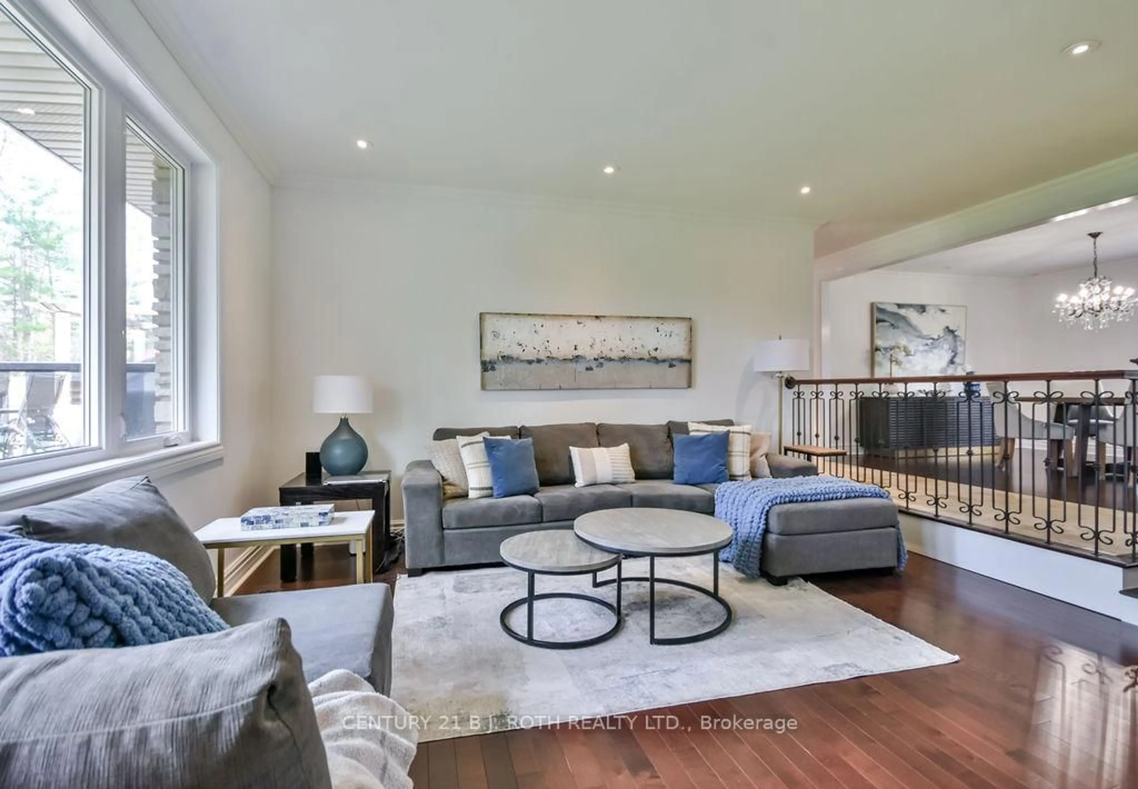 Living room with furniture, wood/laminate floor for 12 Noraline Ave, Springwater Ontario L0L 1X1