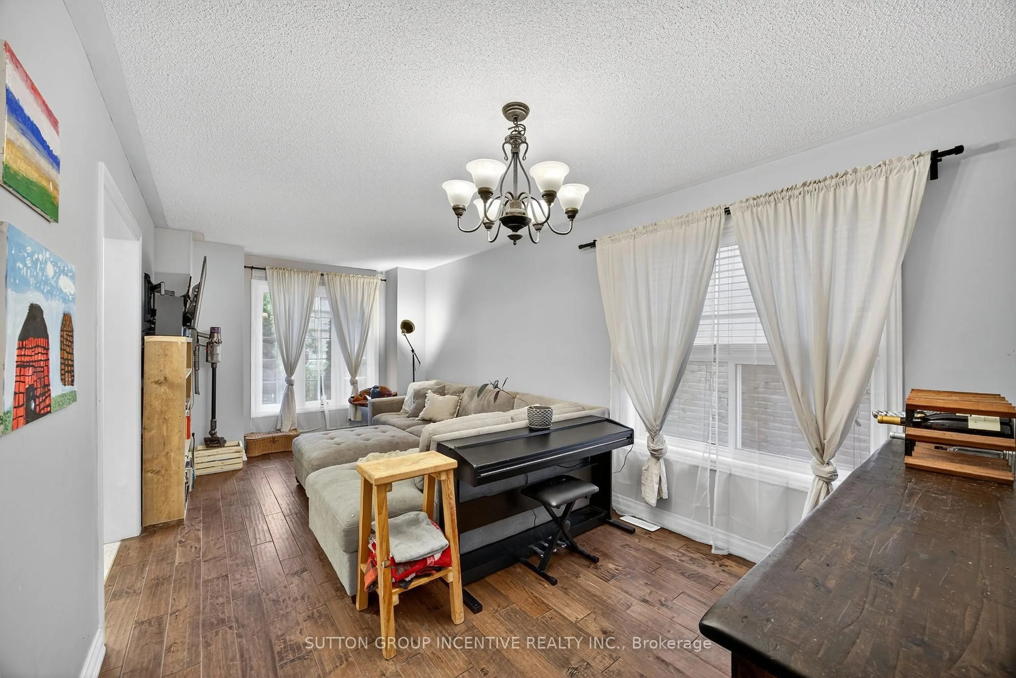 Living room with furniture, wood/laminate floor for 4 Dunnett Dr, Barrie Ontario L4N 0H8