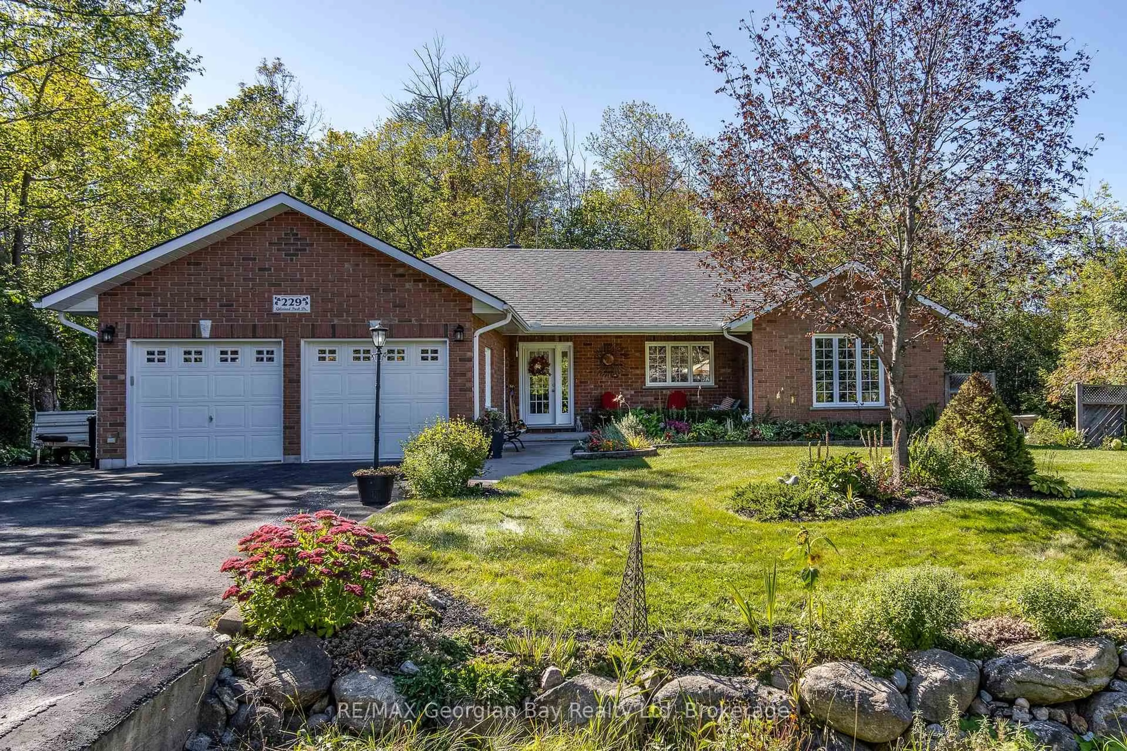 Home with brick exterior material, street for 229 Gilwood Park Dr, Penetanguishene Ontario L9M 1Z4