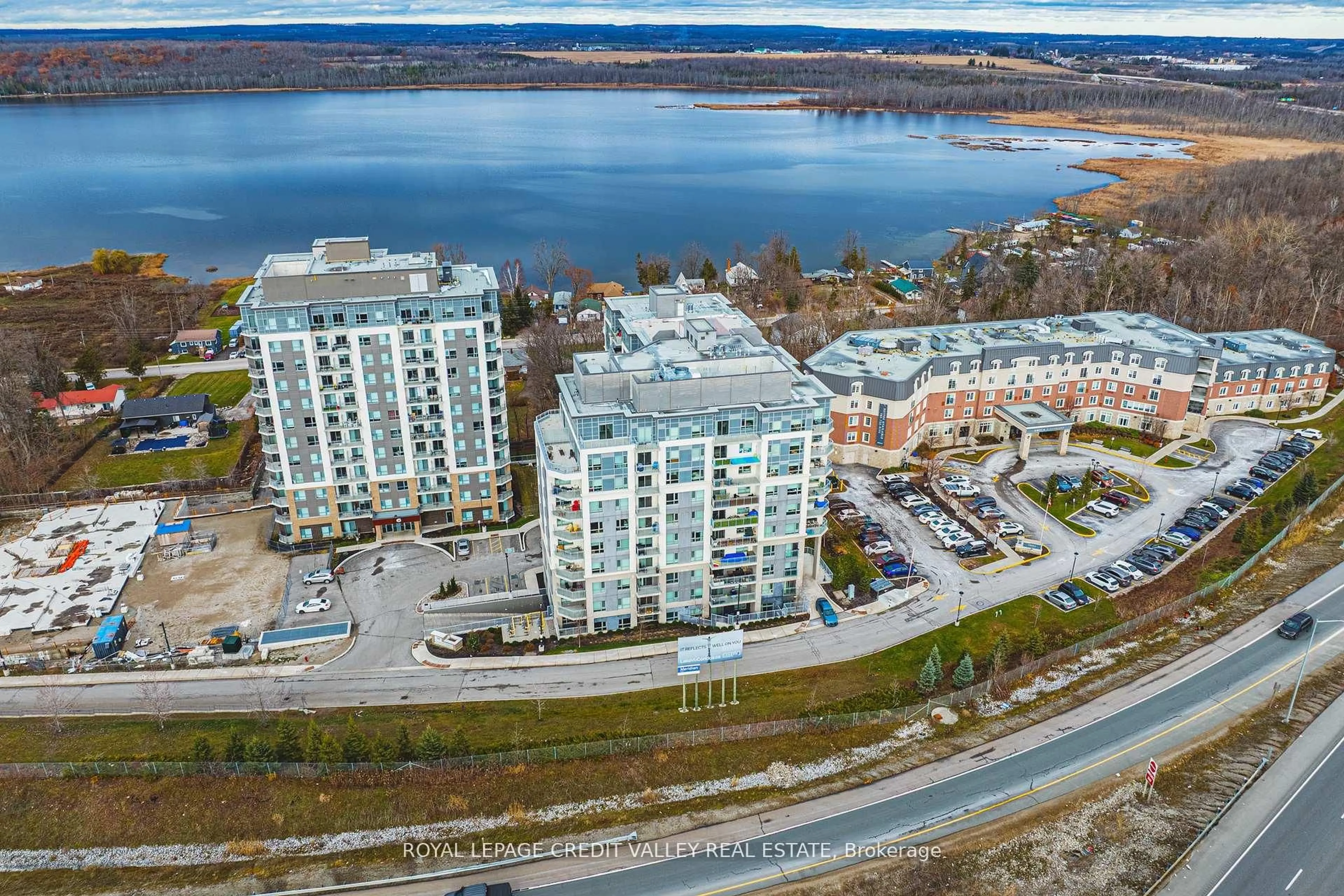 A pic from outside/outdoor area/front of a property/back of a property/a pic from drone, water/lake/river/ocean view for 58 Lakeside Terr #317, Barrie Ontario L4M 0L5