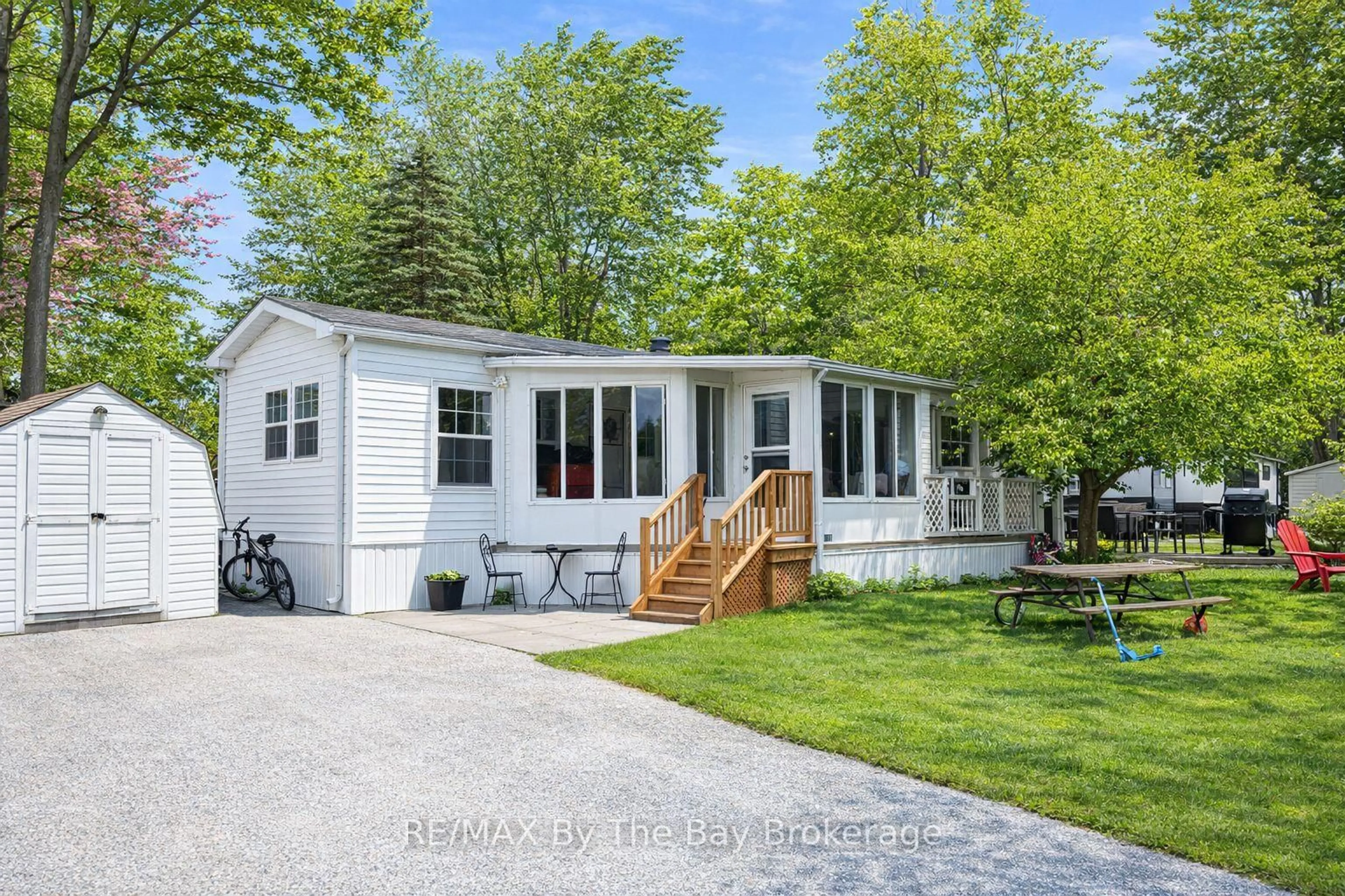 Home with vinyl exterior material, street for 85 THEME PARK Dr #173, Wasaga Beach Ontario L9Z 1X7