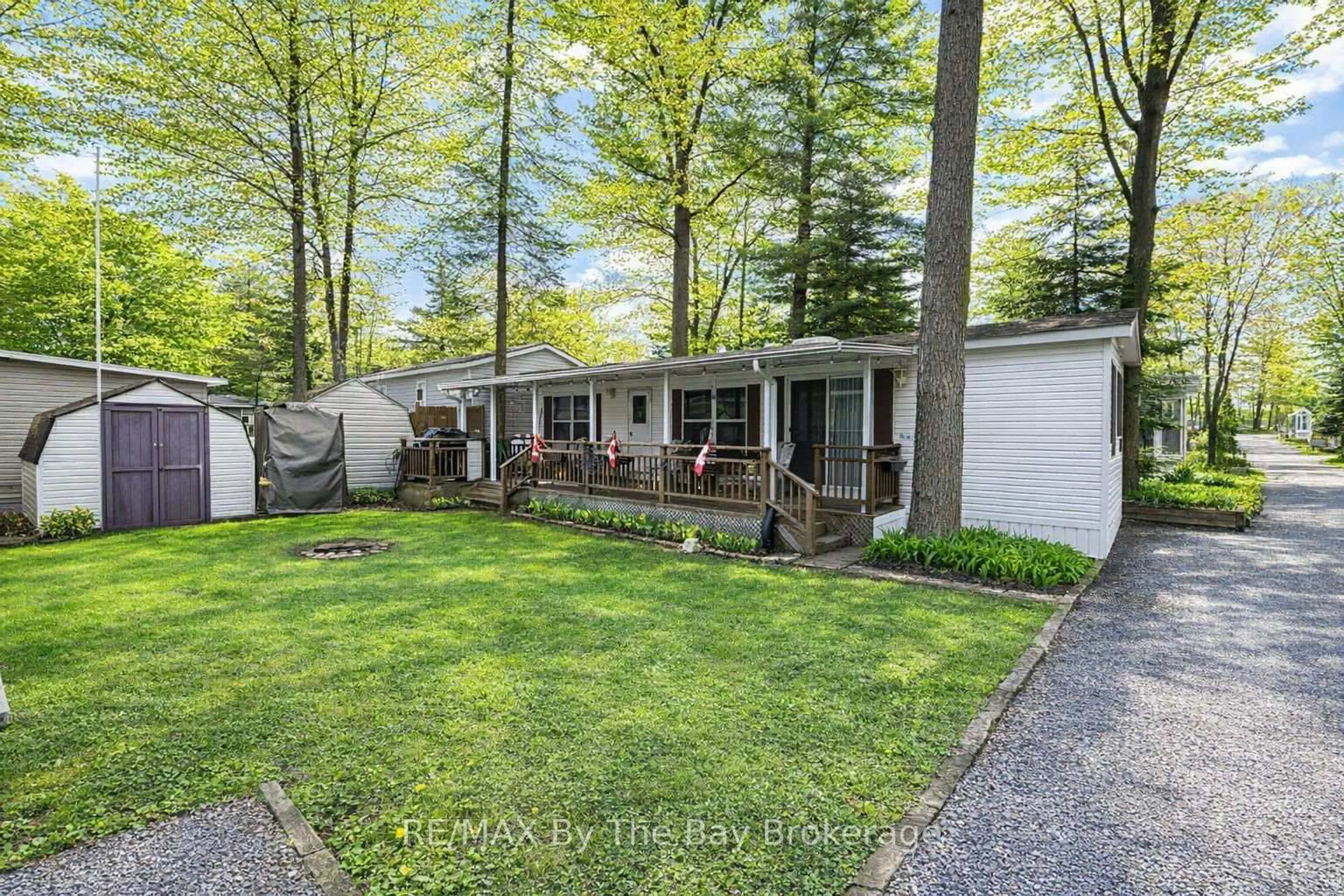 A pic from outside/outdoor area/front of a property/back of a property/a pic from drone, forest/trees view for 85 Theme Park Dr #153, Wasaga Beach Ontario L9Z 1X7