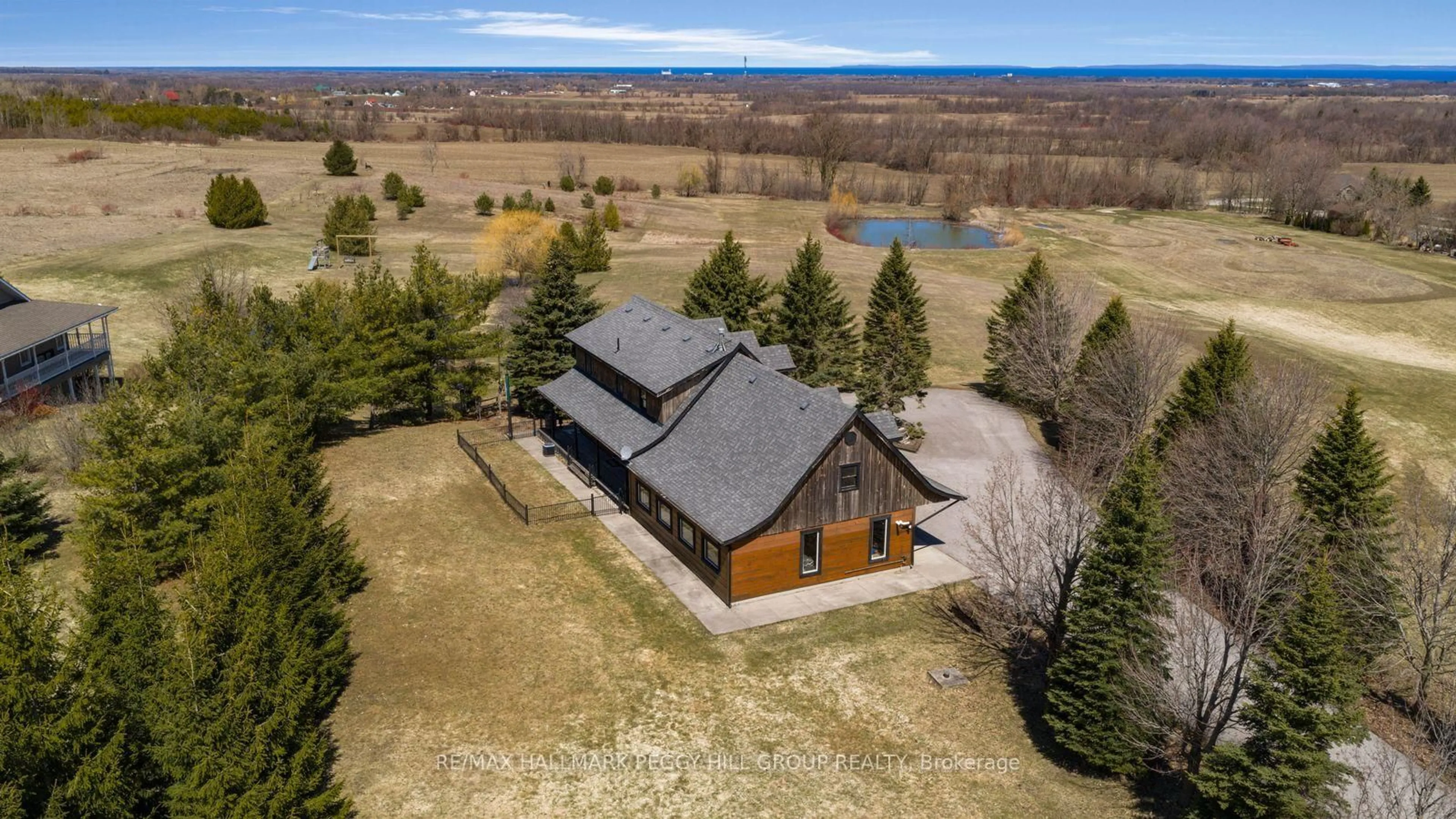 A pic from outside/outdoor area/front of a property/back of a property/a pic from drone, water/lake/river/ocean view for 8886 County Road 91, Clearview Ontario L0M 1H0