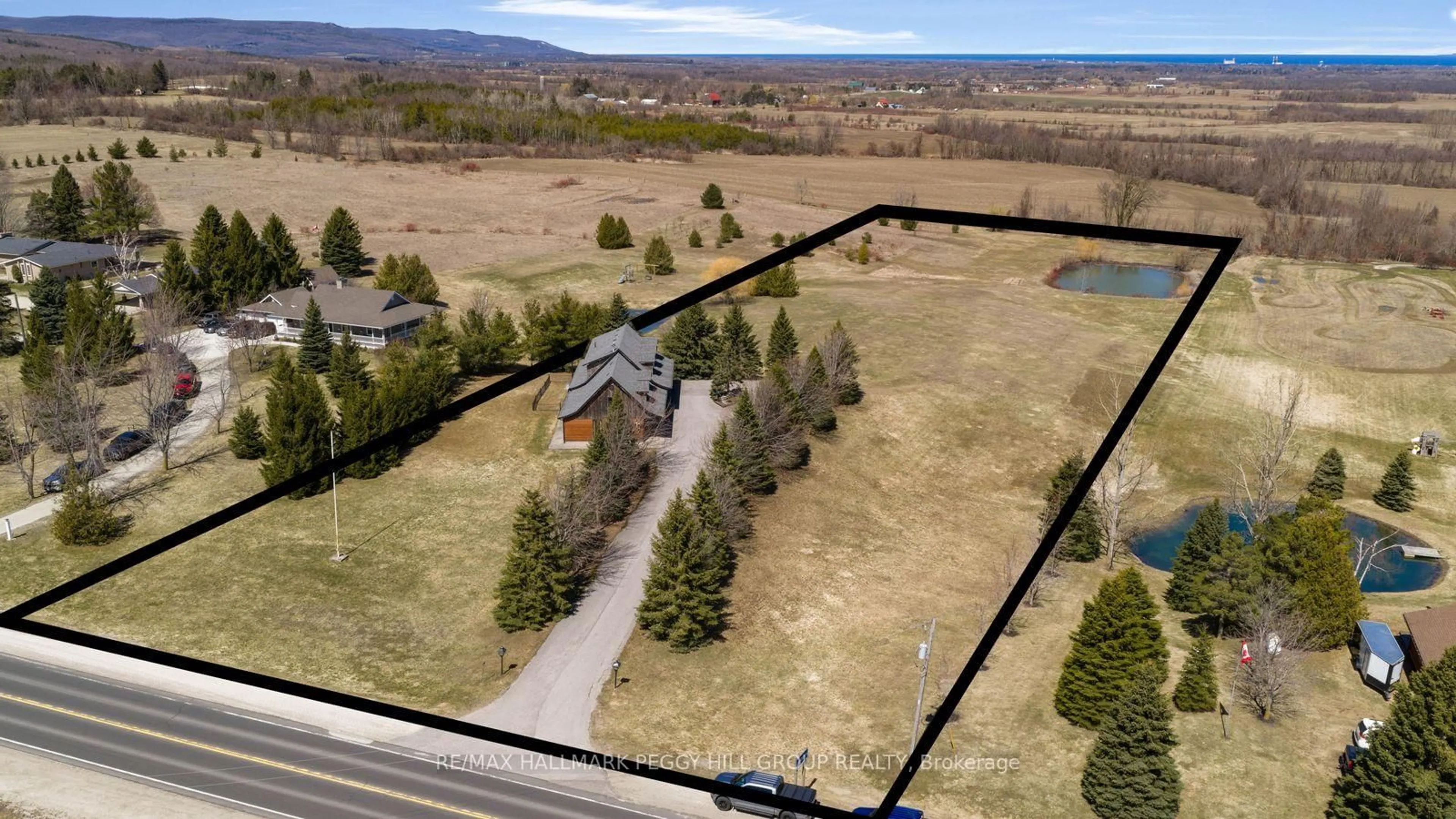 A pic from outside/outdoor area/front of a property/back of a property/a pic from drone, mountain view for 8886 County Road 91, Clearview Ontario L0M 1H0