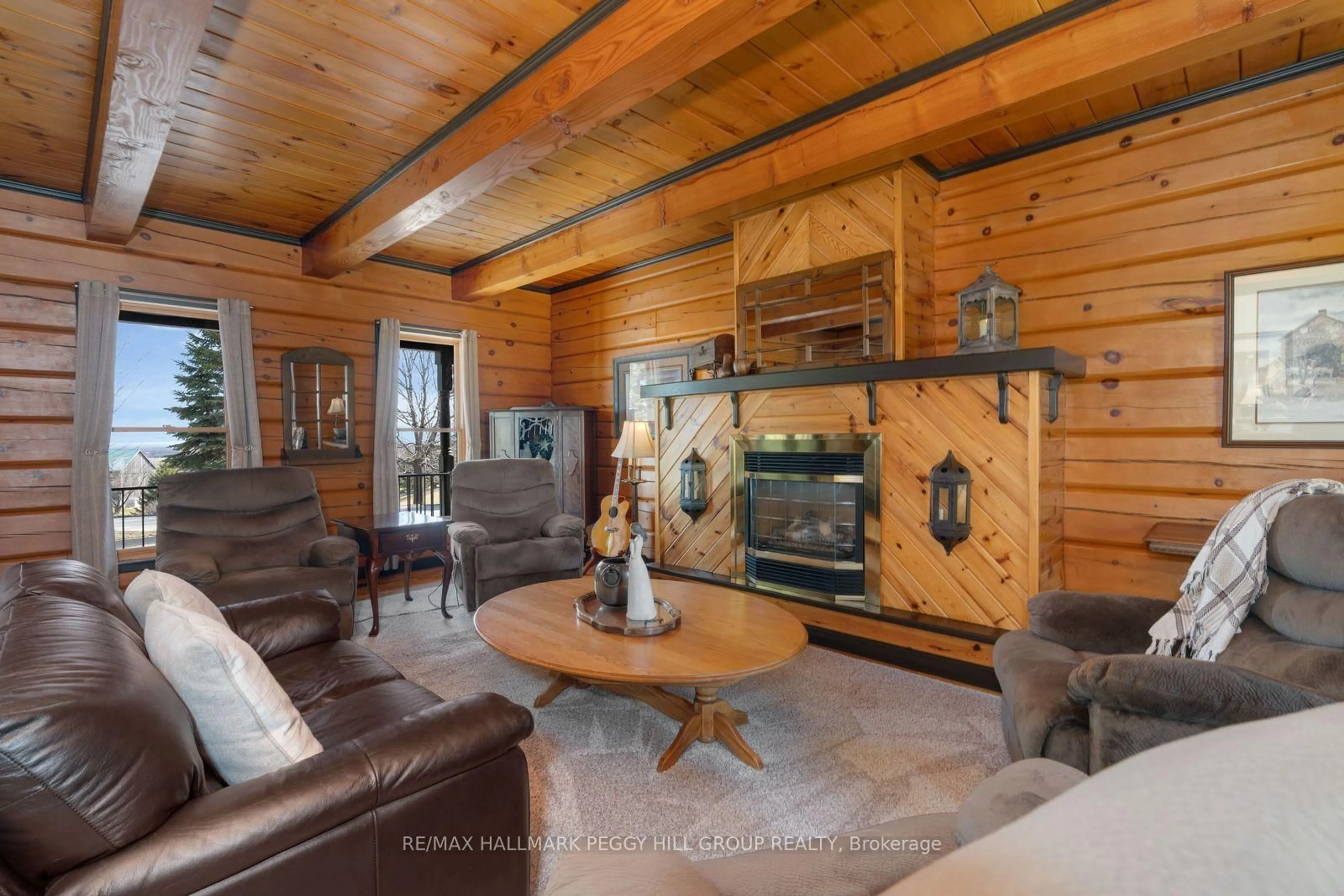 Living room with furniture, wood/laminate floor for 8886 County Road 91, Clearview Ontario L0M 1H0