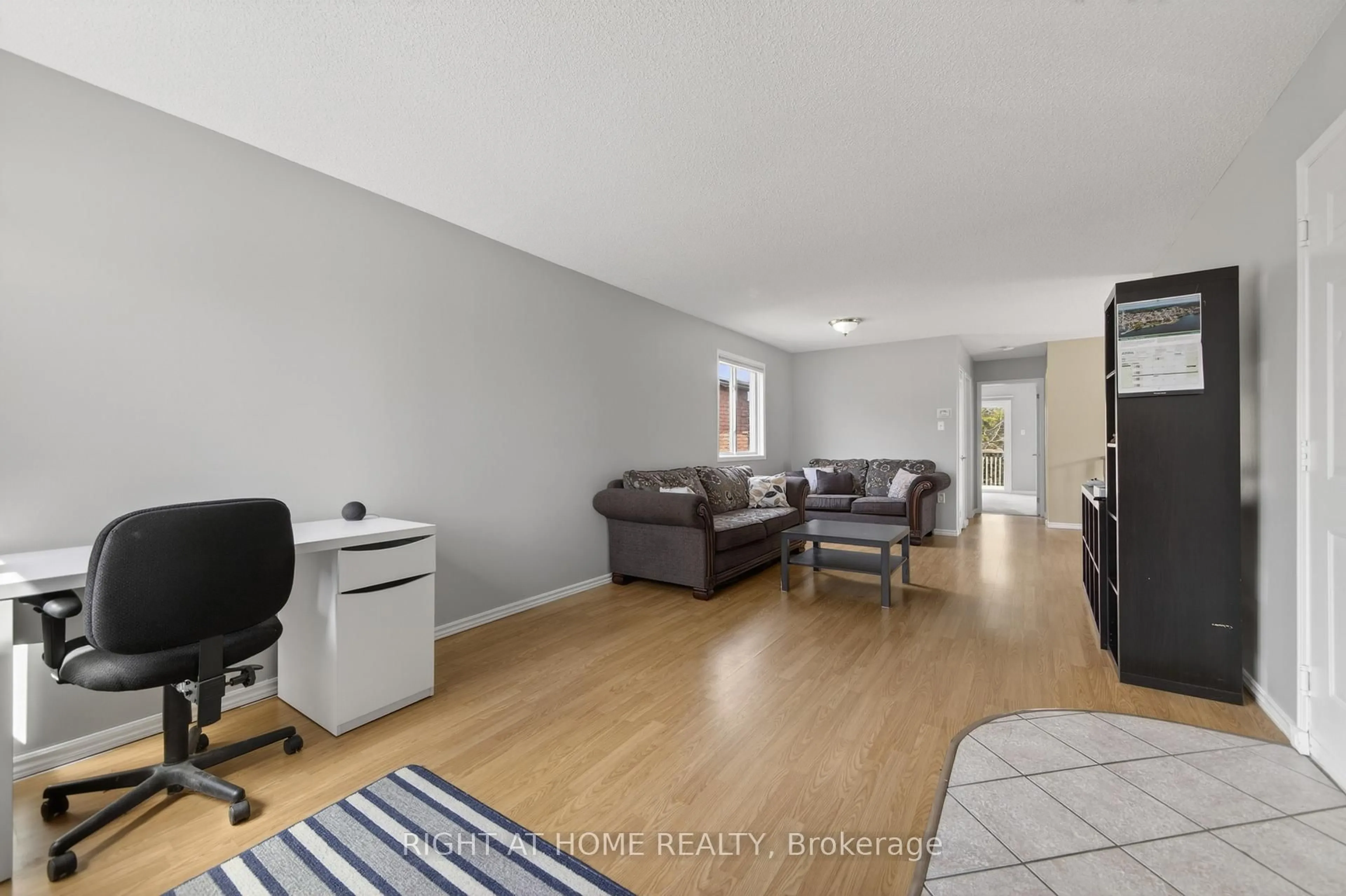 Living room with furniture, wood/laminate floor for 40 Arthur Ave, Barrie Ontario L4M 6H4