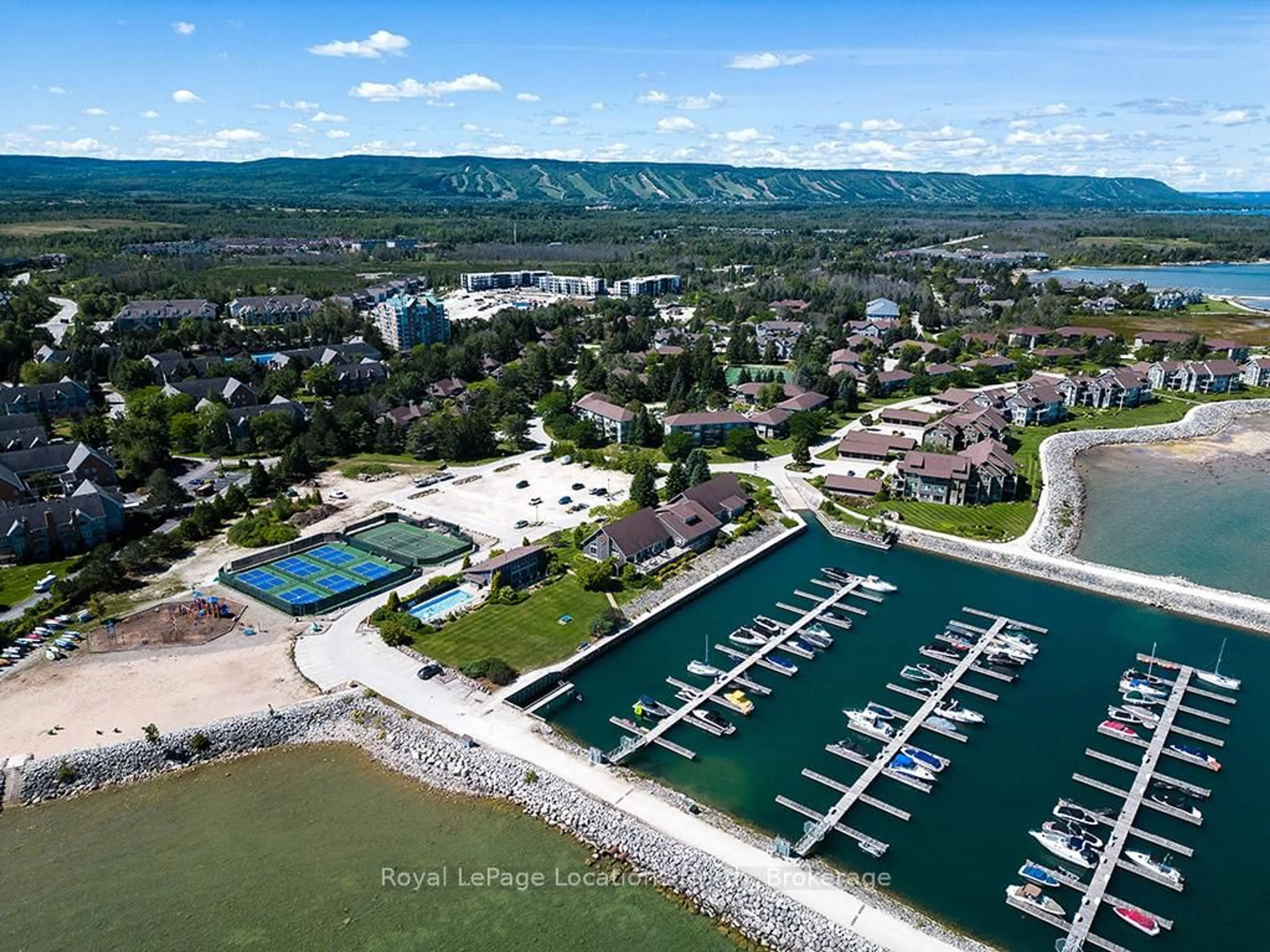 A pic from outside/outdoor area/front of a property/back of a property/a pic from drone, water/lake/river/ocean view for 330 Mariners Way, Collingwood Ontario L9Y 5C7