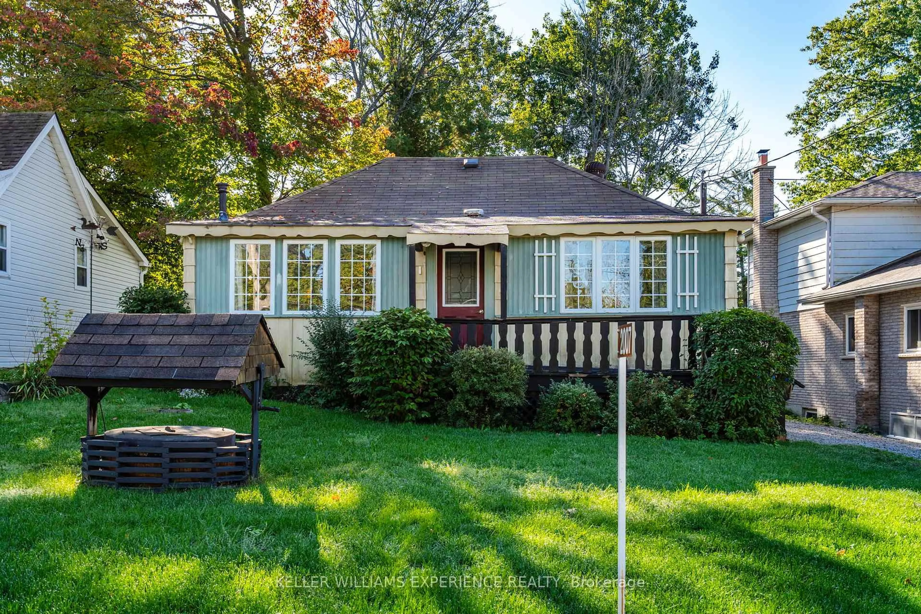 Home with vinyl exterior material, street for 2007 Tiny Beaches Rd, Tiny Ontario L0L 1P1