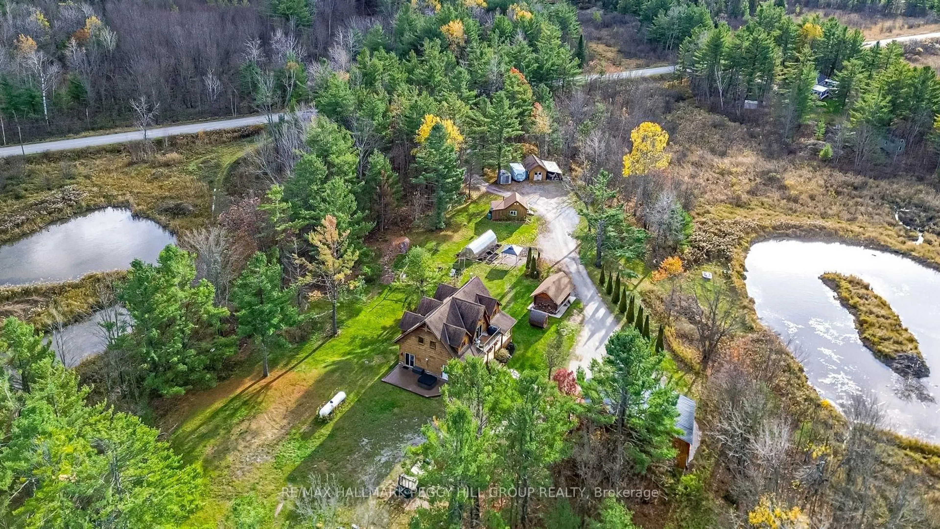 A pic from outside/outdoor area/front of a property/back of a property/a pic from drone, forest/trees view for 2504 Fairgrounds Rd, Ramara Ontario L0K 2B0