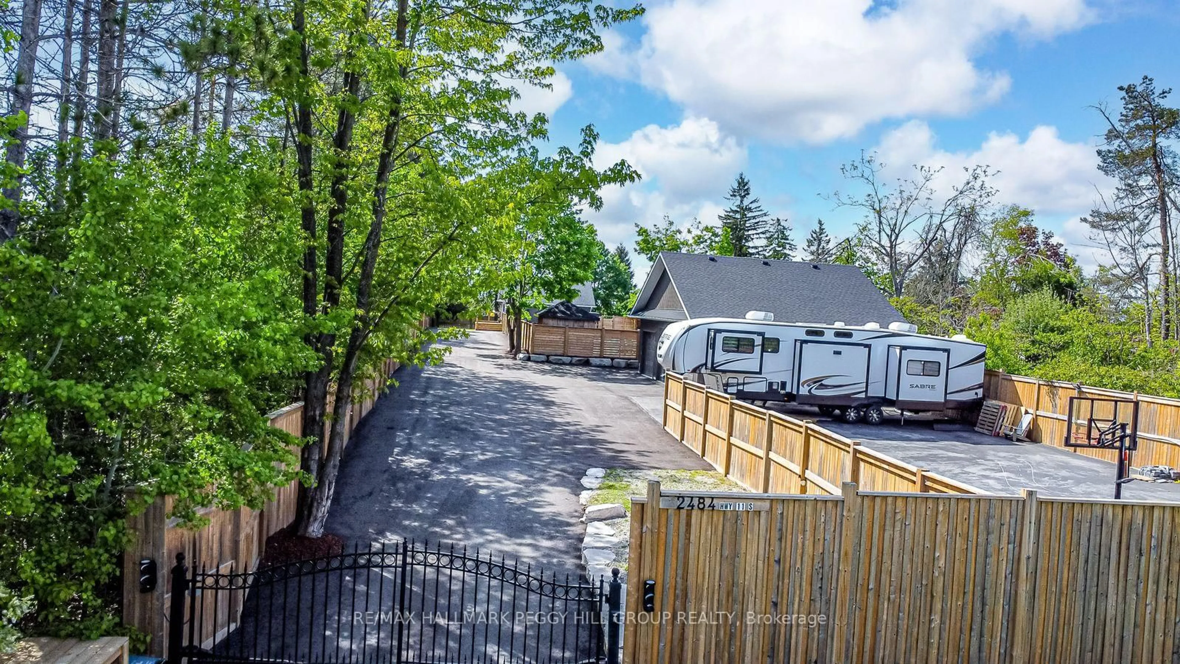 A pic from outside/outdoor area/front of a property/back of a property/a pic from drone, street for 2484 Highway 11, Oro-Medonte Ontario L0L 2E0
