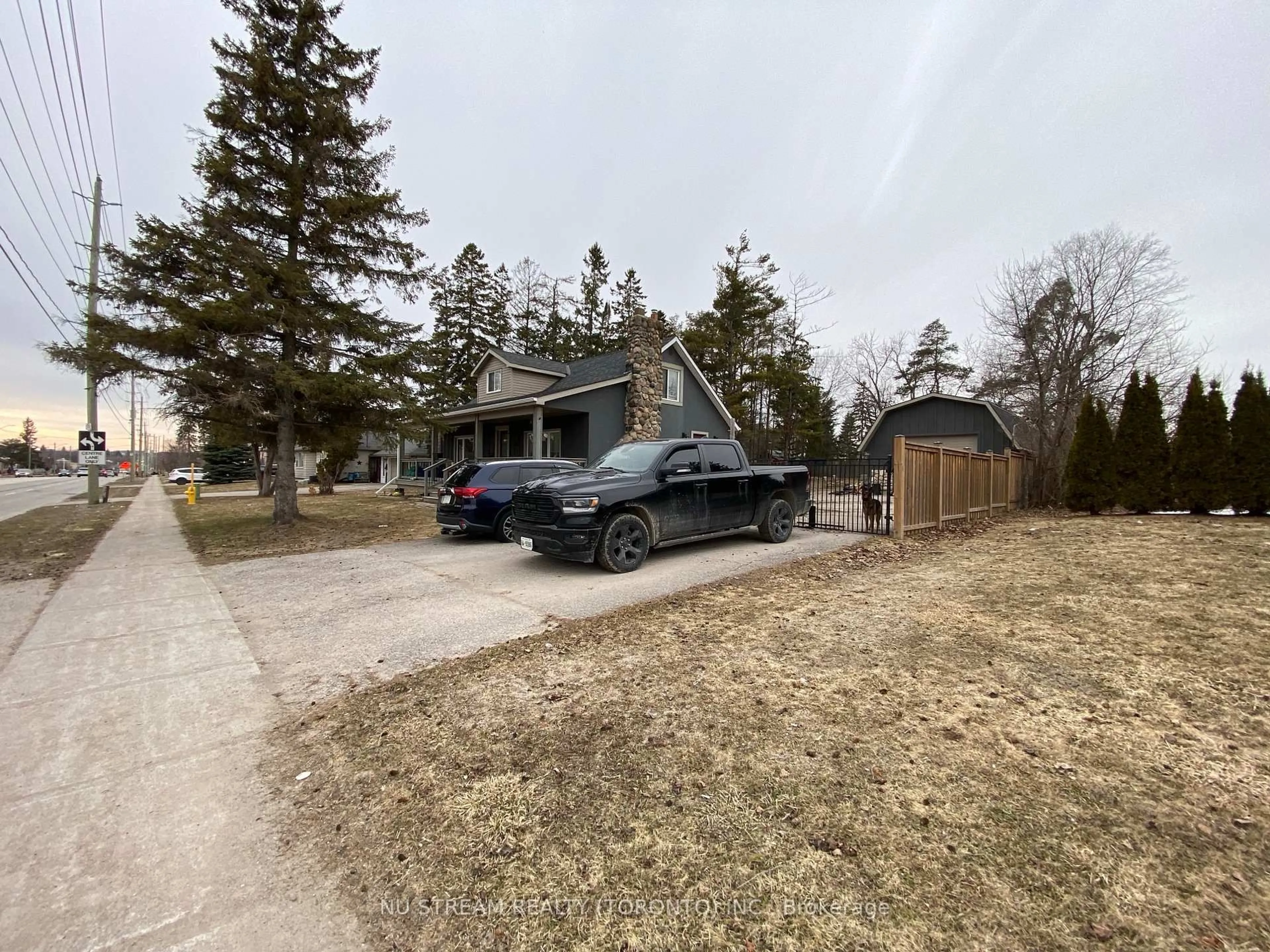A pic from outside/outdoor area/front of a property/back of a property/a pic from drone, street for 544 Big Bay Point Rd, Barrie Ontario L4N 3Z5