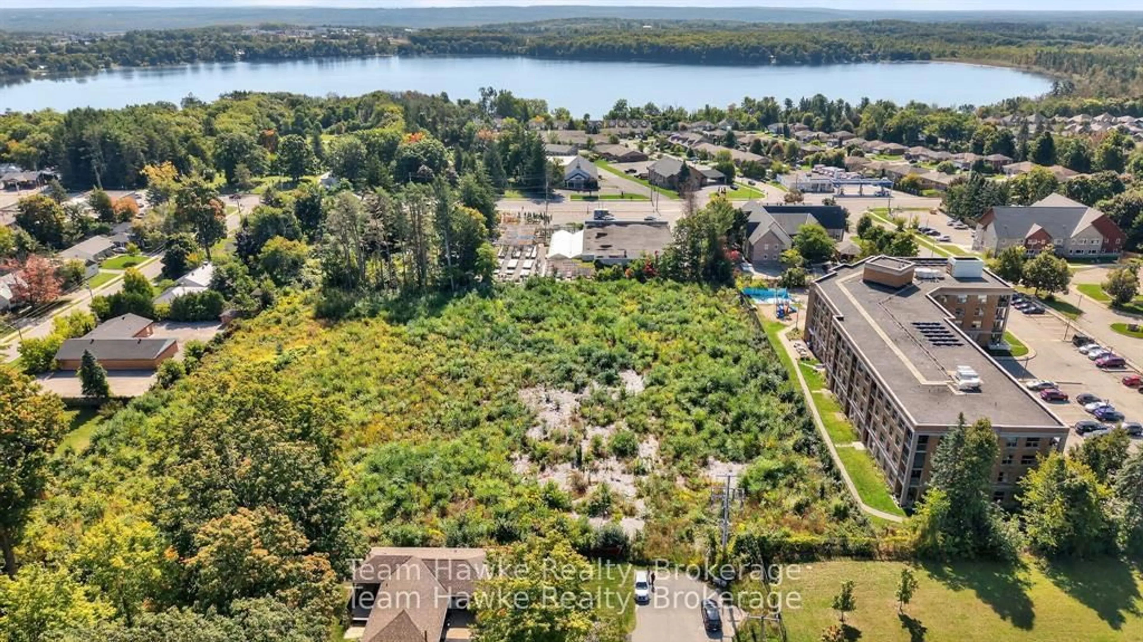A pic from outside/outdoor area/front of a property/back of a property/a pic from drone, water/lake/river/ocean view for 319 Gervais St #2A, Midland Ontario L4R 4C6