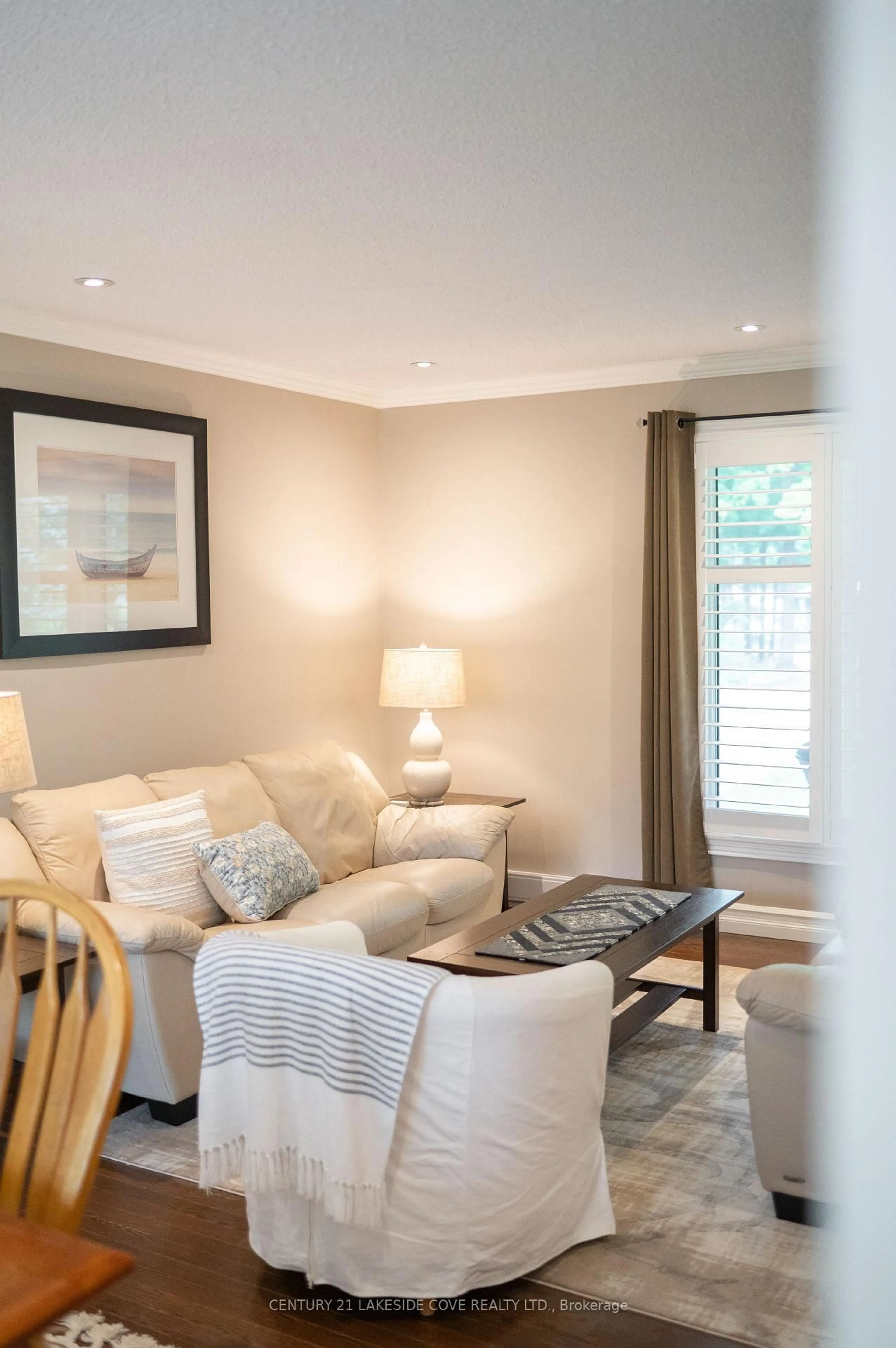 Living room with furniture, wood/laminate floor for 27 Thicketwood Pl, Ramara Ontario L0K 1B0