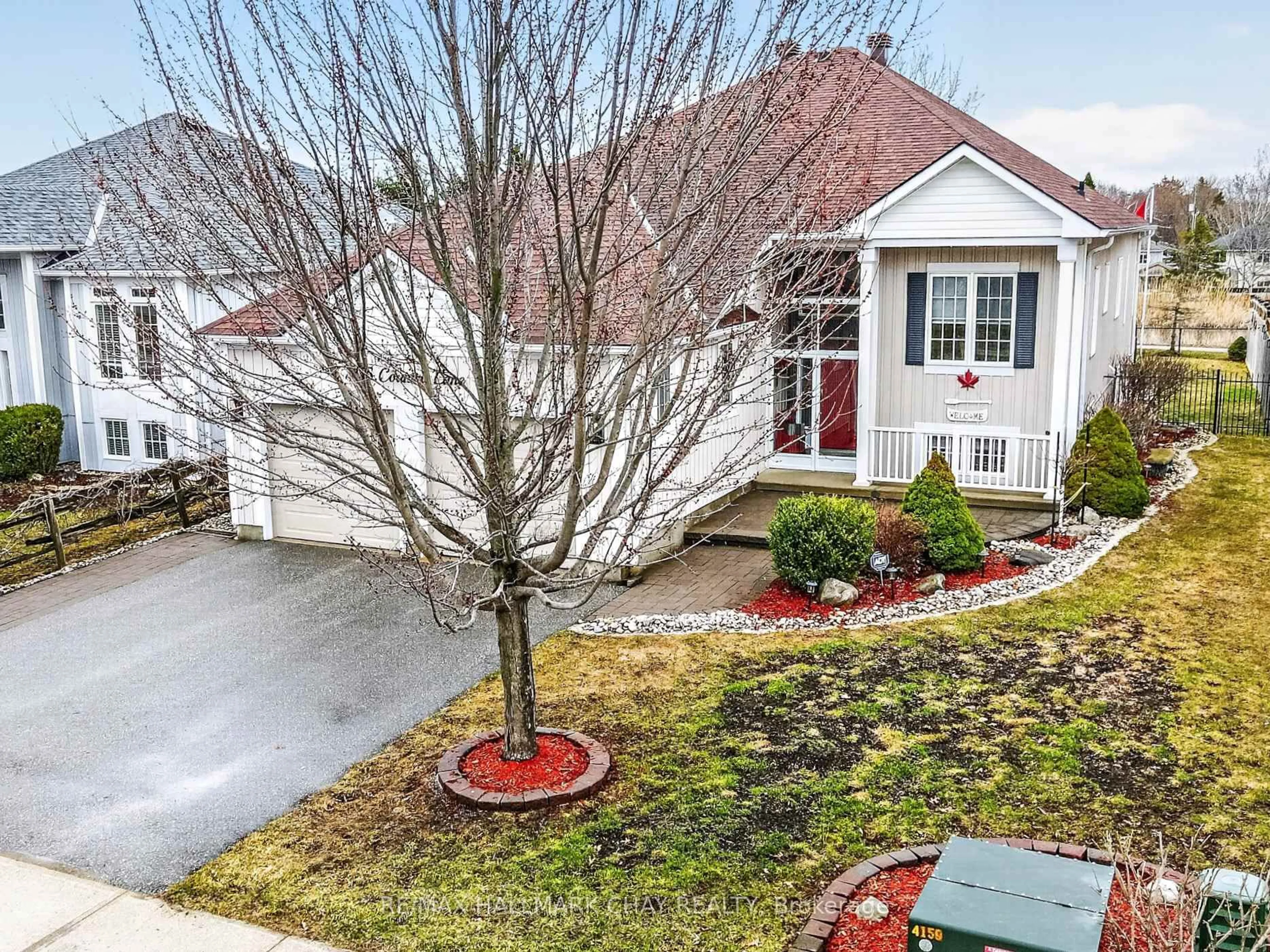 A pic from outside/outdoor area/front of a property/back of a property/a pic from drone, street for 205 Country Lane, Clearview Ontario L0M 1S0