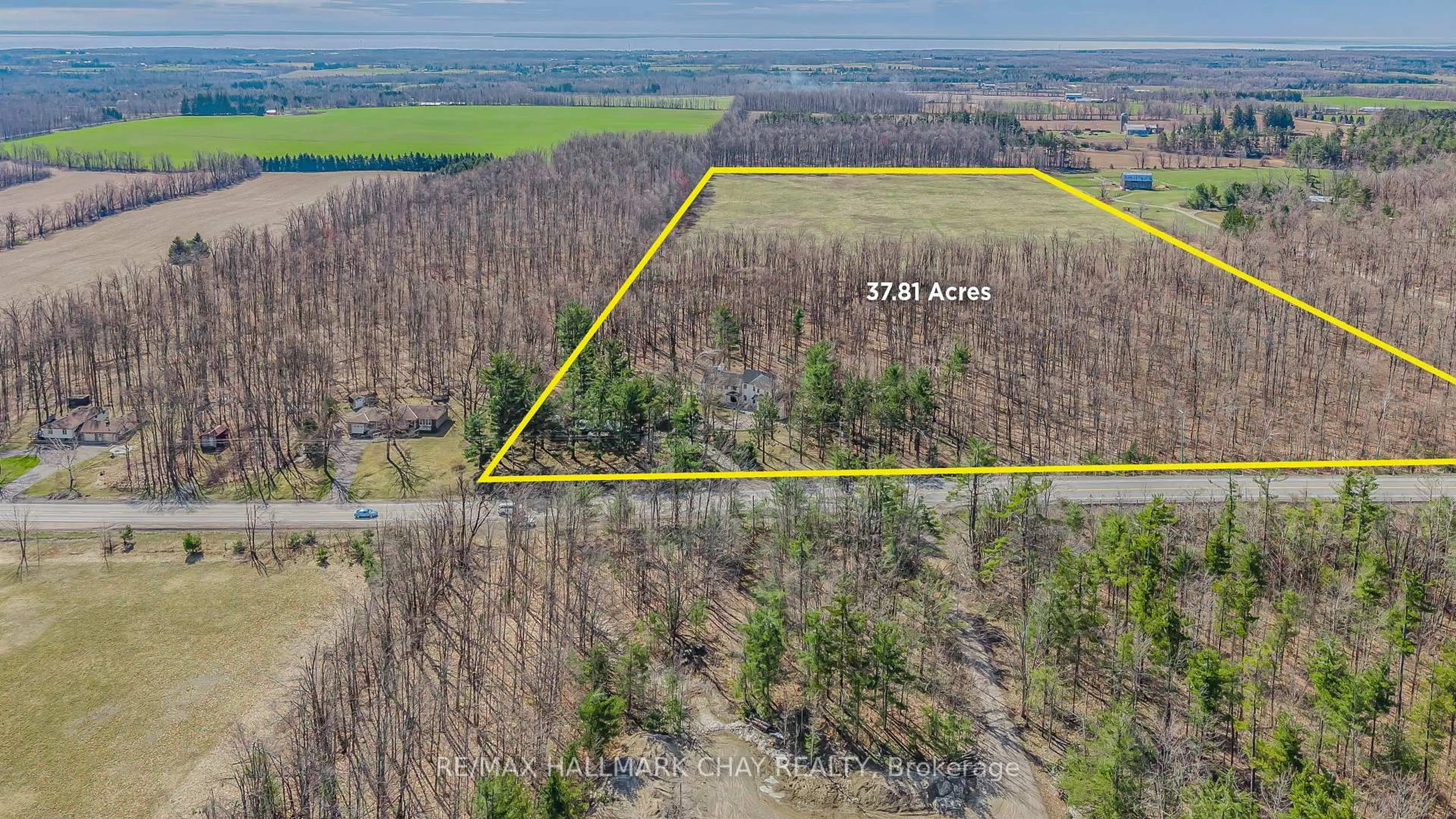 A pic from outside/outdoor area/front of a property/back of a property/a pic from drone, forest/trees view for 1359 Old Barrie Rd, Oro-Medonte Ontario L0L 1T0