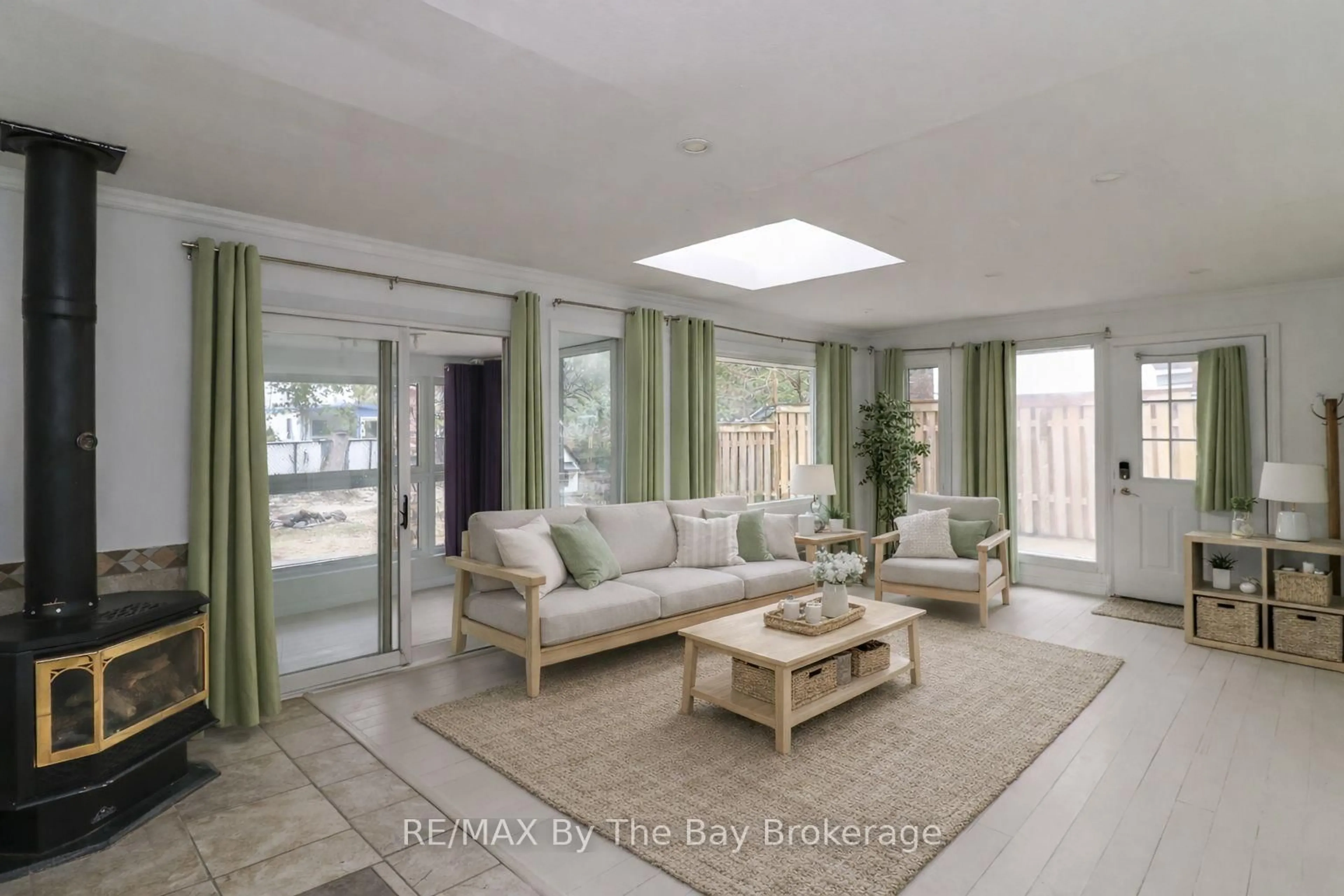 Living room with furniture, ceramic/tile floor for 54 Homewood Ave, Wasaga Beach Ontario L9Z 2M2