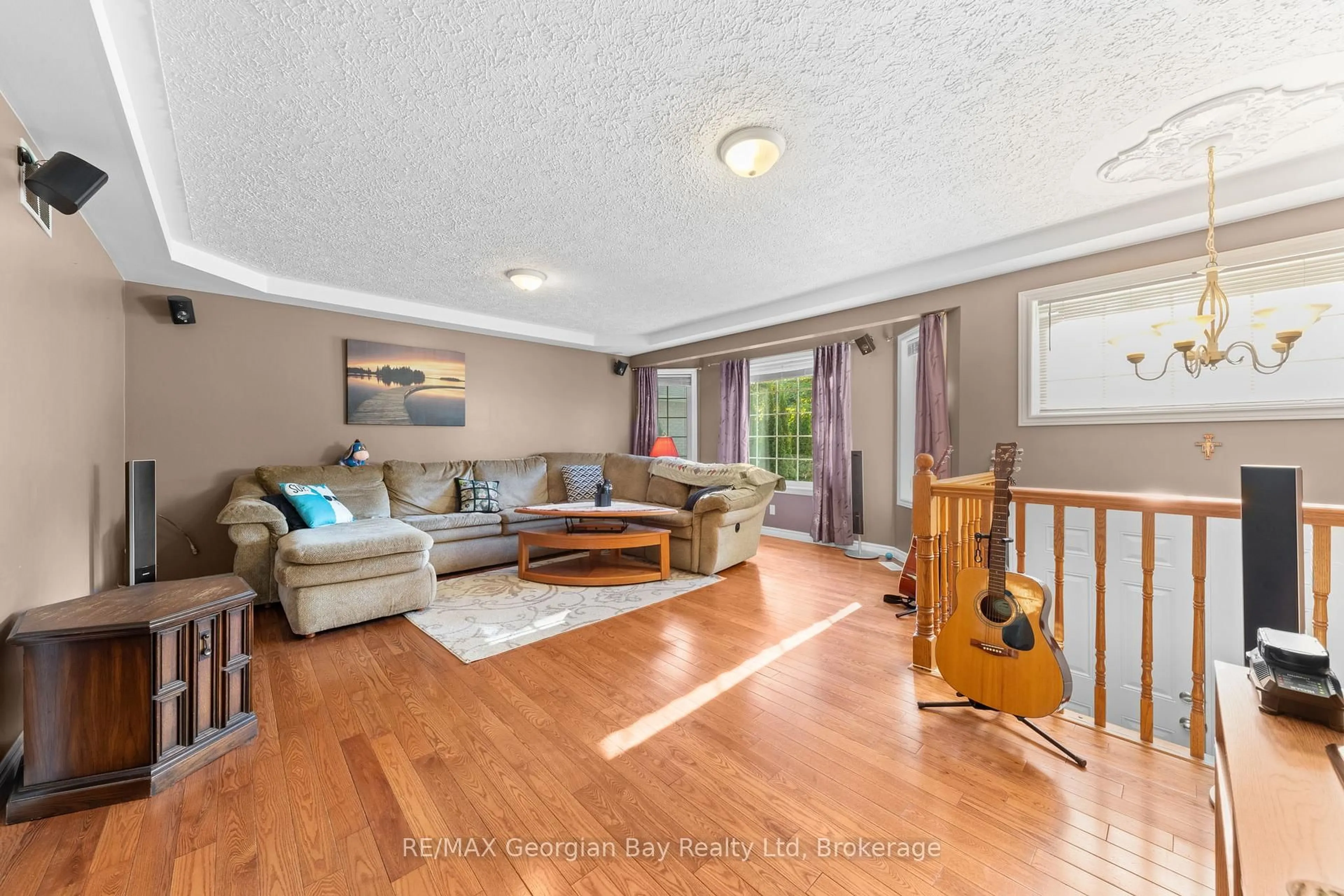 Living room with furniture, wood/laminate floor for 477 ALBERT St, Tay Ontario L0K 2A0