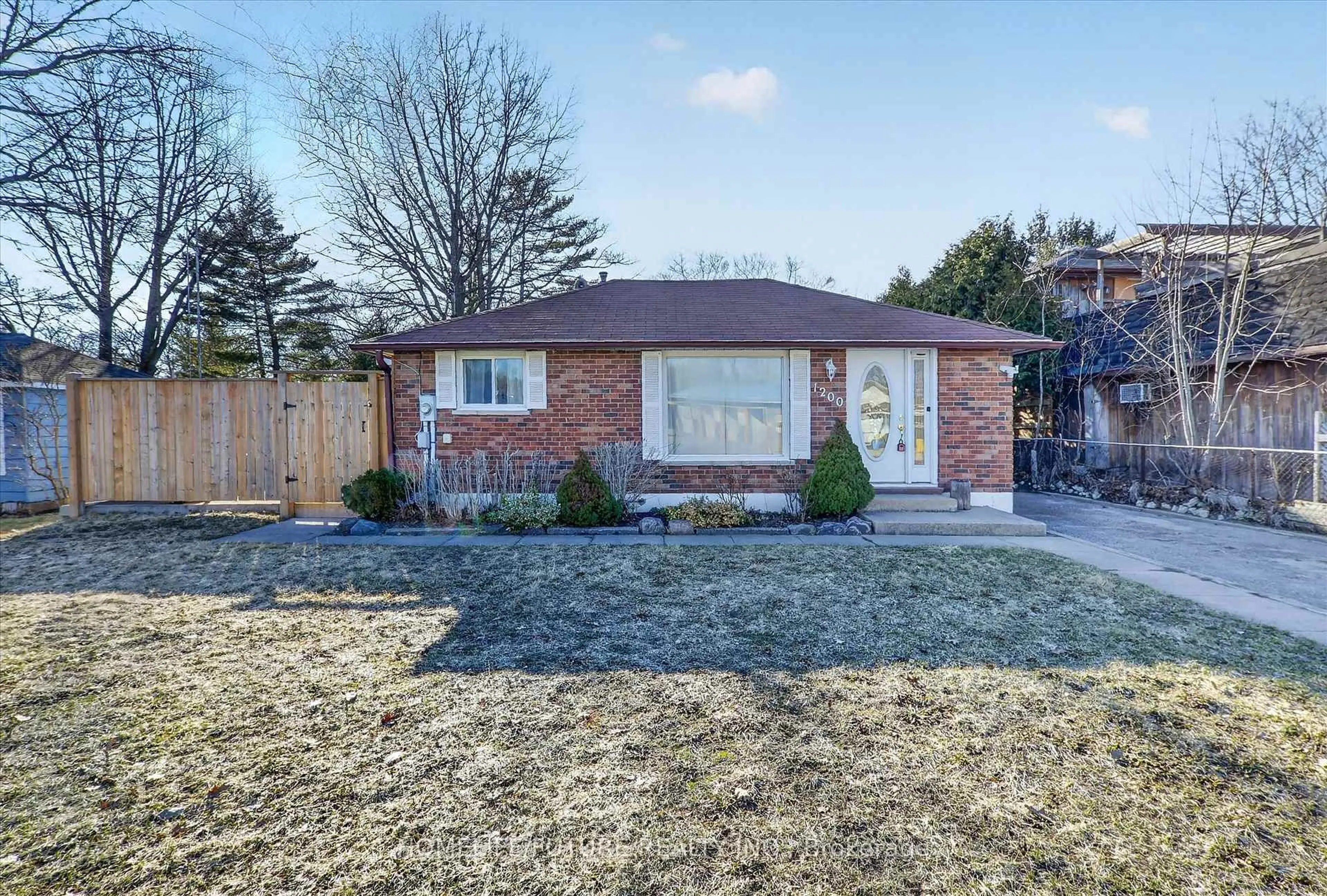 Home with brick exterior material, street for 1200 Mosley St, Wasaga Beach Ontario L9Z 2E7