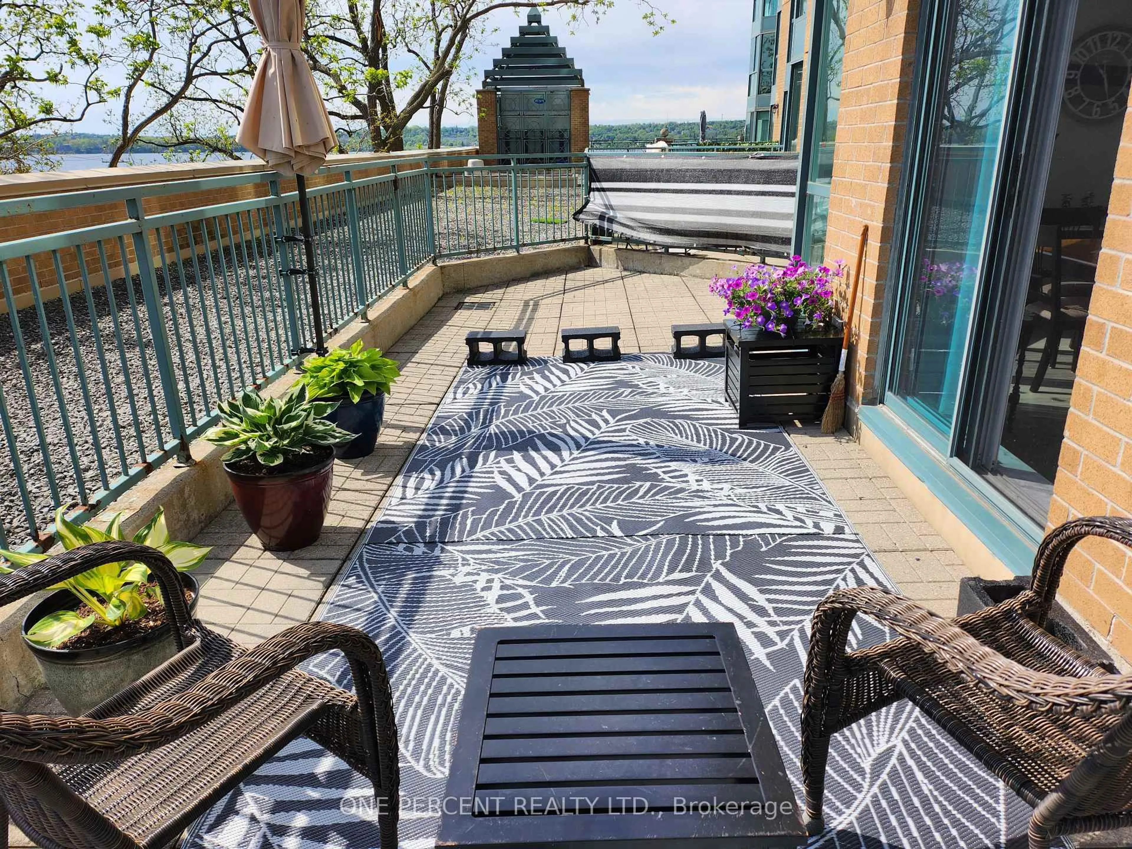 Patio, city buildings view from balcony for 150 Dunlop St #311, Barrie Ontario L4M 6H1