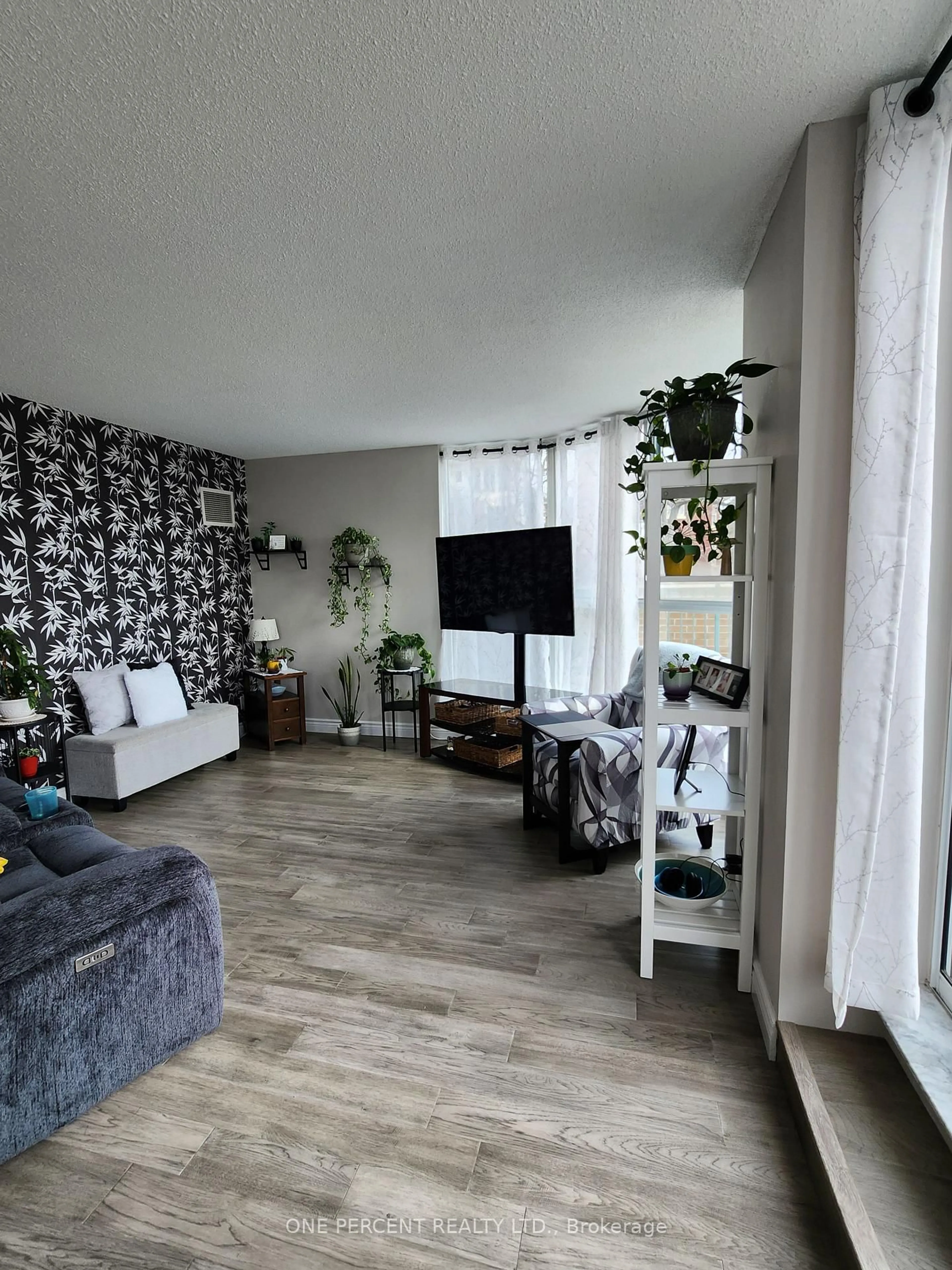 Living room with furniture, unknown for 150 Dunlop St #311, Barrie Ontario L4M 6H1