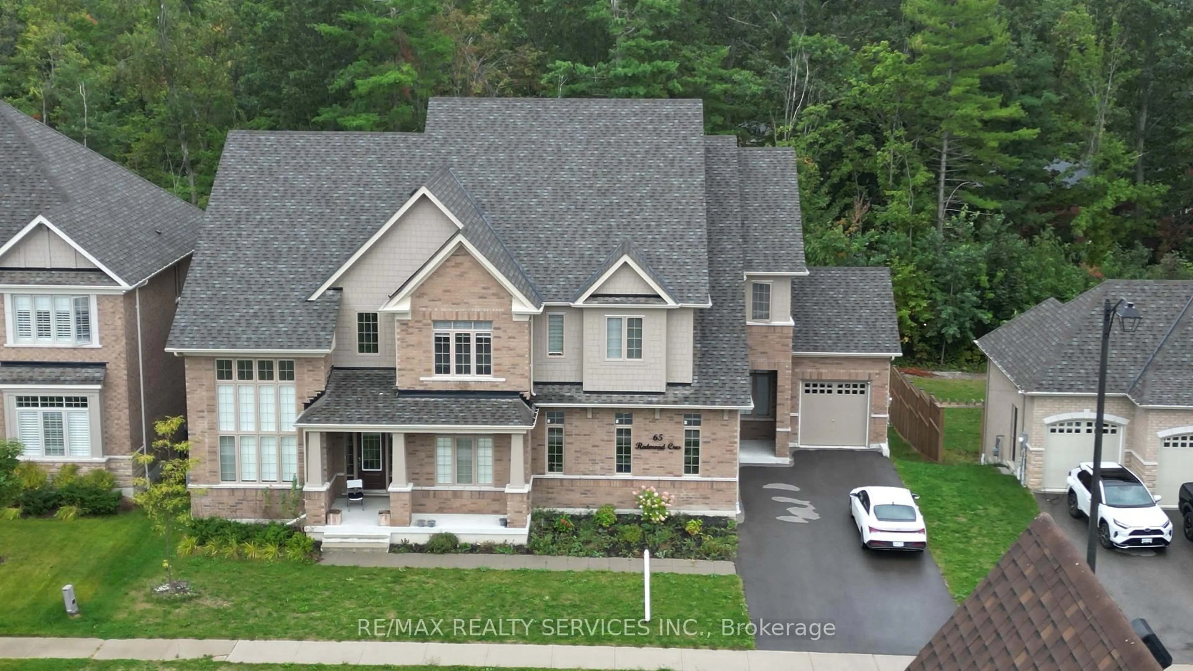 Home with brick exterior material, street for 65 Redmond Cres, Springwater Ontario L9X 1Z8