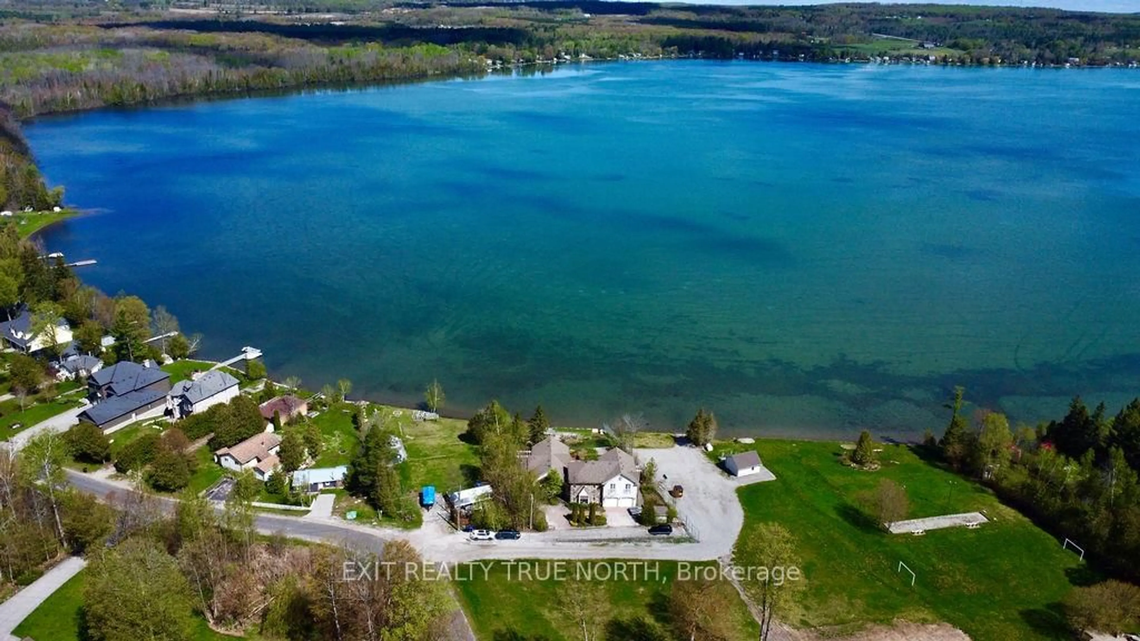 A pic from outside/outdoor area/front of a property/back of a property/a pic from drone, water/lake/river/ocean view for 3021 Sandy Bend, Springwater Ontario L0L 1P0