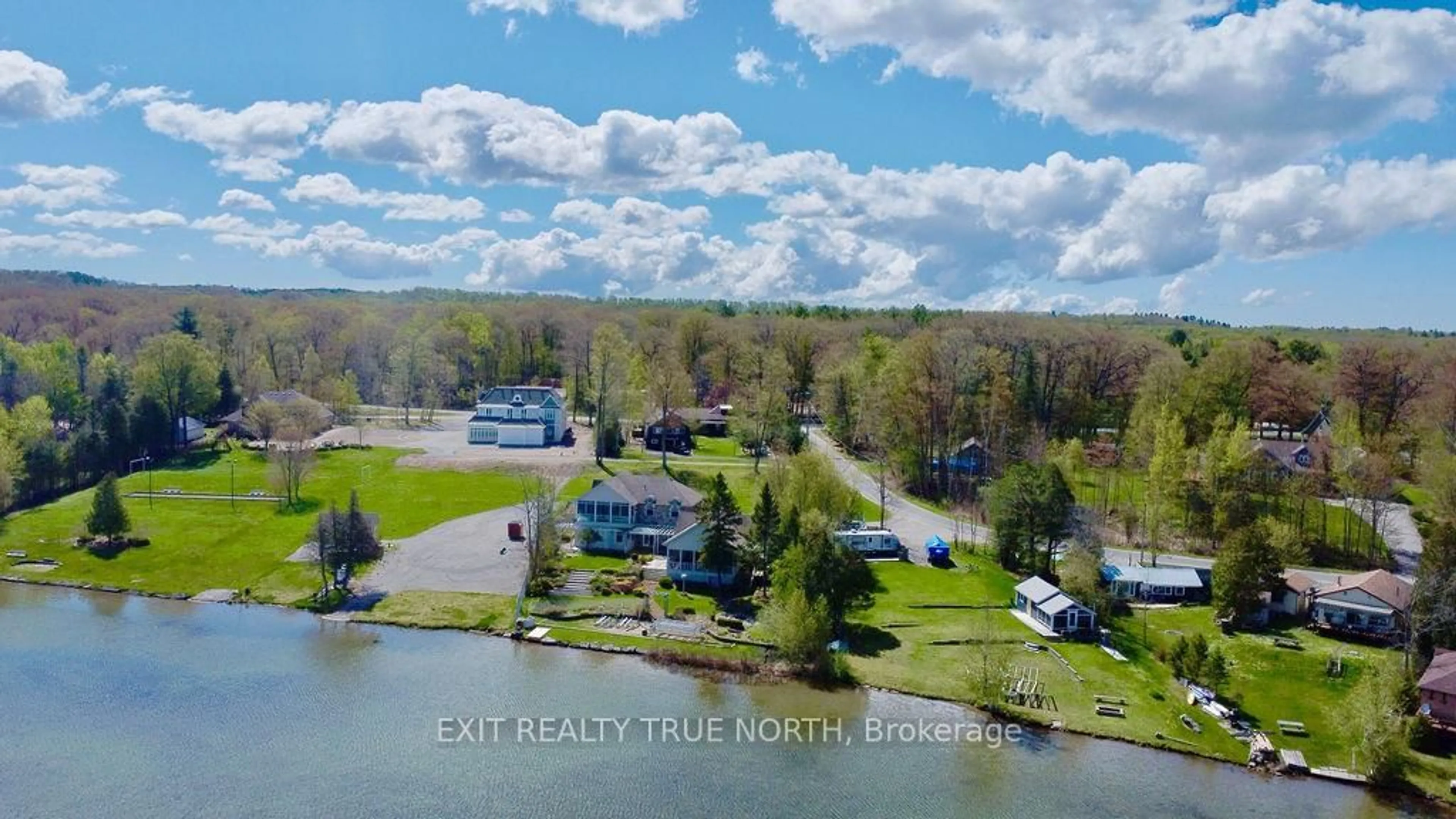 A pic from outside/outdoor area/front of a property/back of a property/a pic from drone, water/lake/river/ocean view for 3021 Sandy Bend, Springwater Ontario L0L 1P0