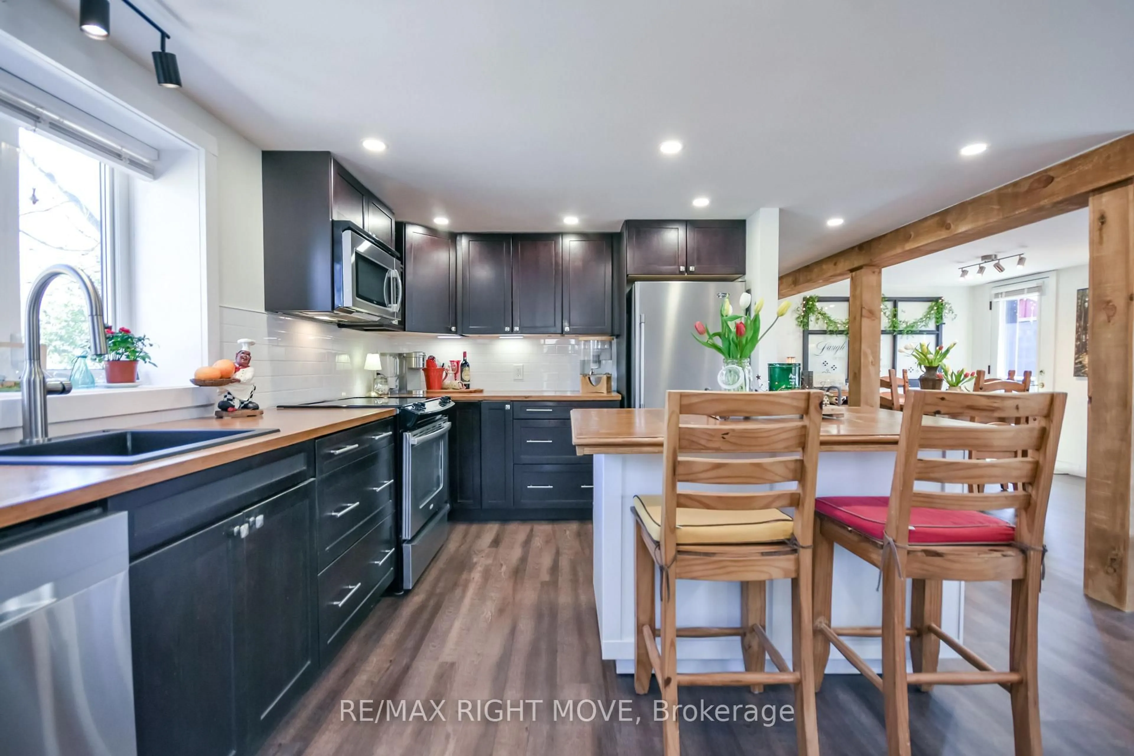 Open concept kitchen, wood/laminate floor for 51 Walker Ave, Orillia Ontario L3V 6G9