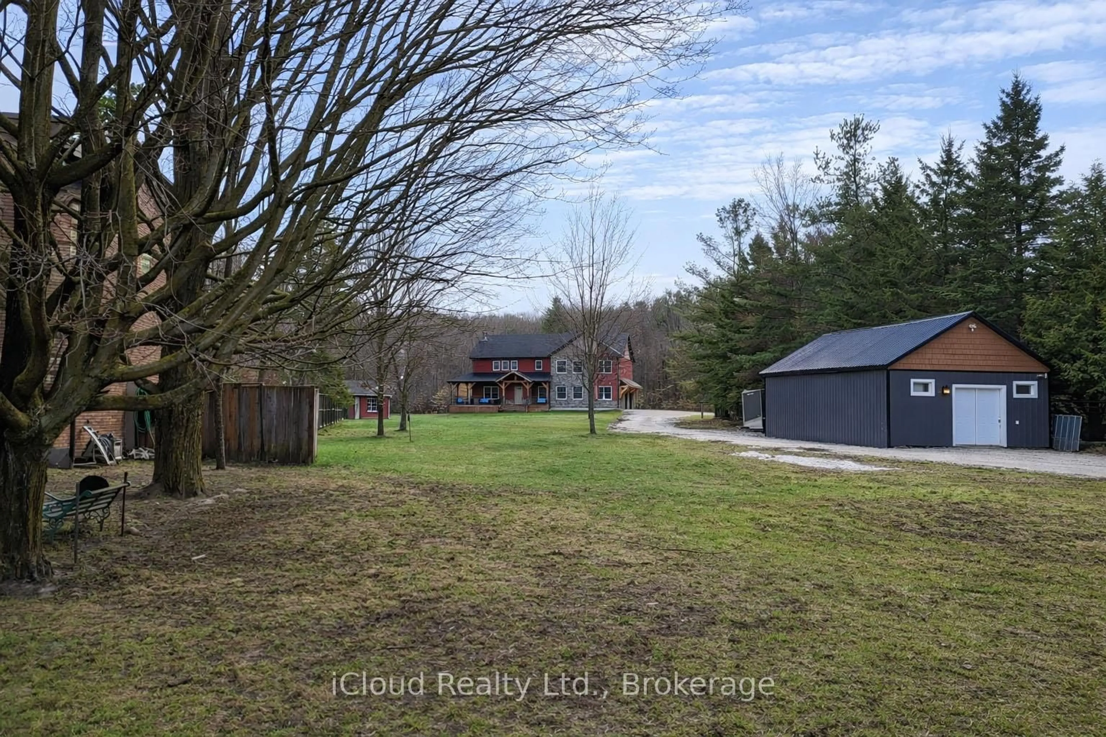 A pic from outside/outdoor area/front of a property/back of a property/a pic from drone, forest/trees view for 2091 Dwyer Rd, Springwater Ontario L9X 1L7