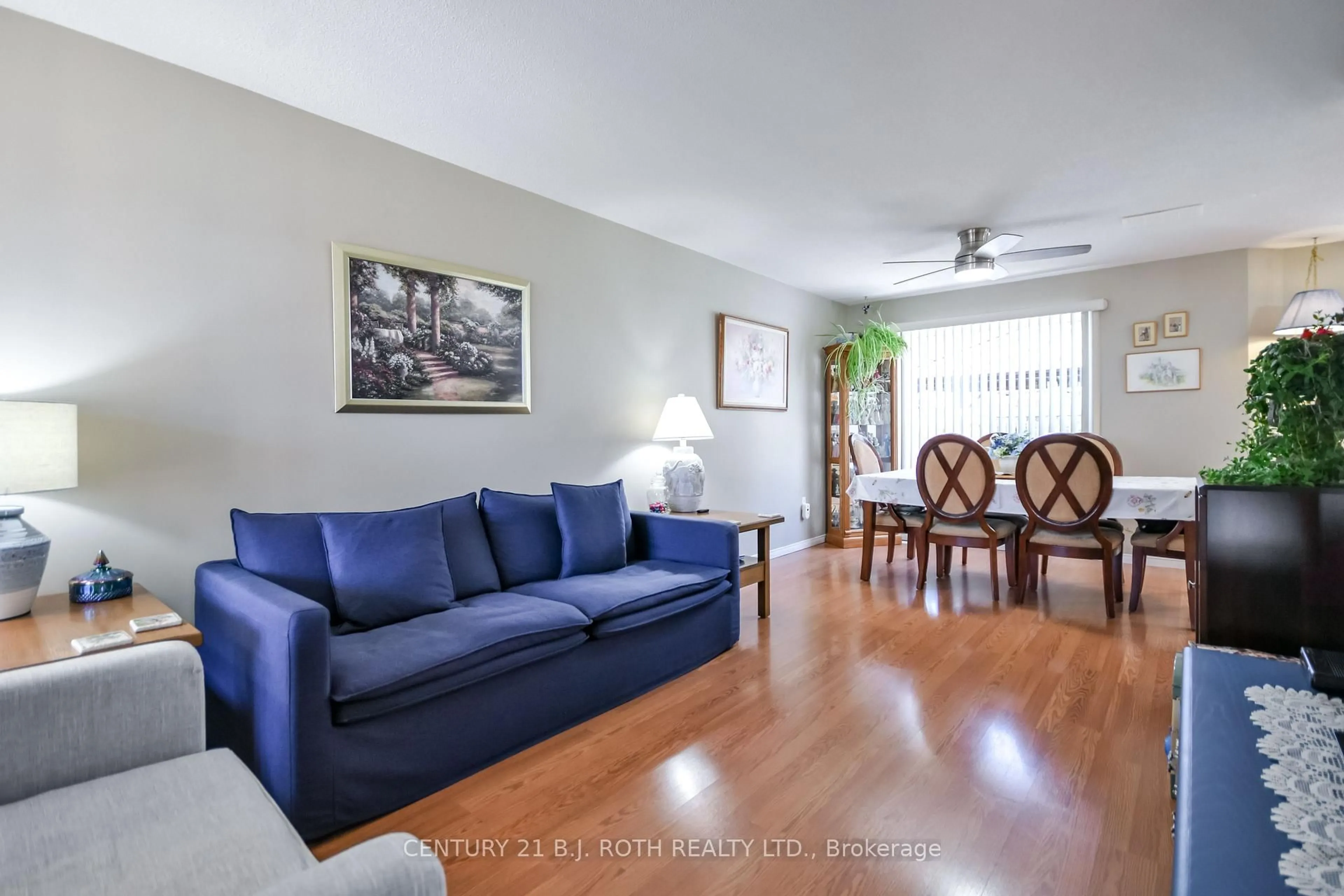 Living room with furniture, wood/laminate floor for 62 Loon Ave, Barrie Ontario L4N 8V9