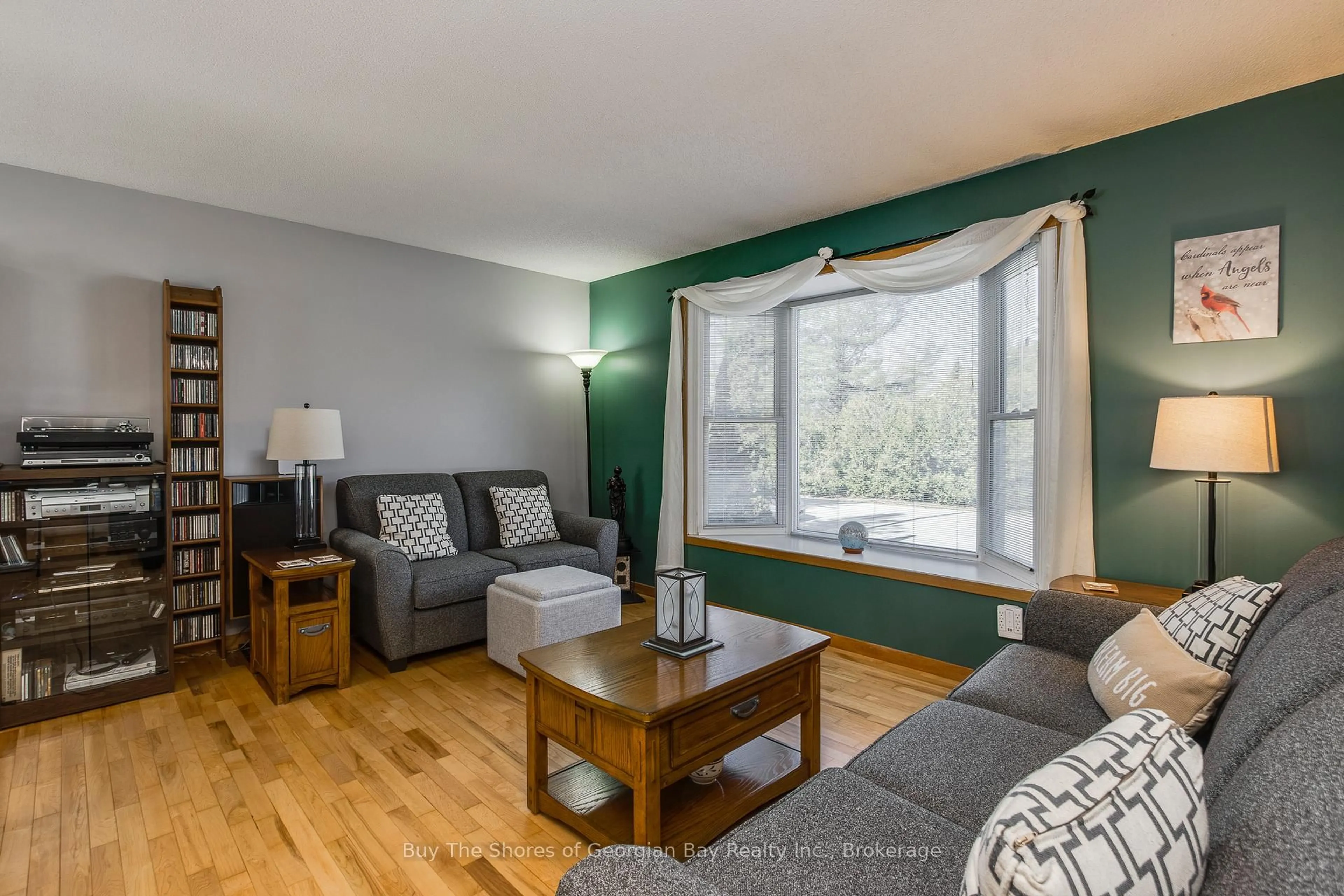 Living room with furniture, wood/laminate floor for 147 Lumber Rd, Tay Ontario L0K 2A0