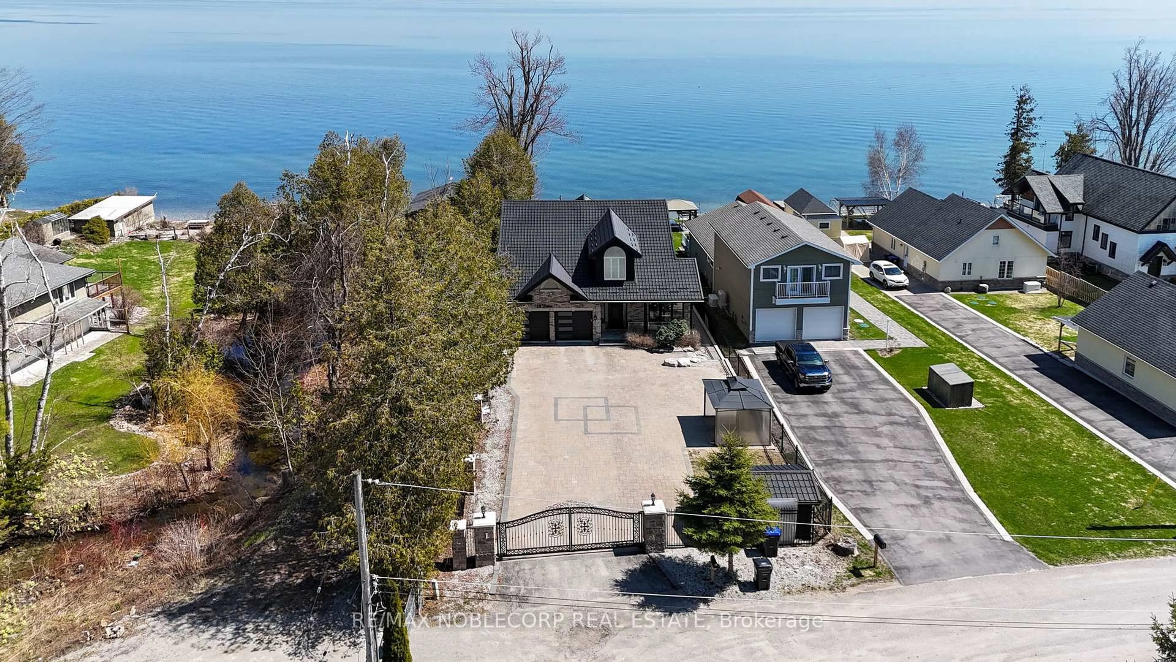 A pic from outside/outdoor area/front of a property/back of a property/a pic from drone, water/lake/river/ocean view for 15 Palm Beach Rd, Oro-Medonte Ontario L0L 1T0
