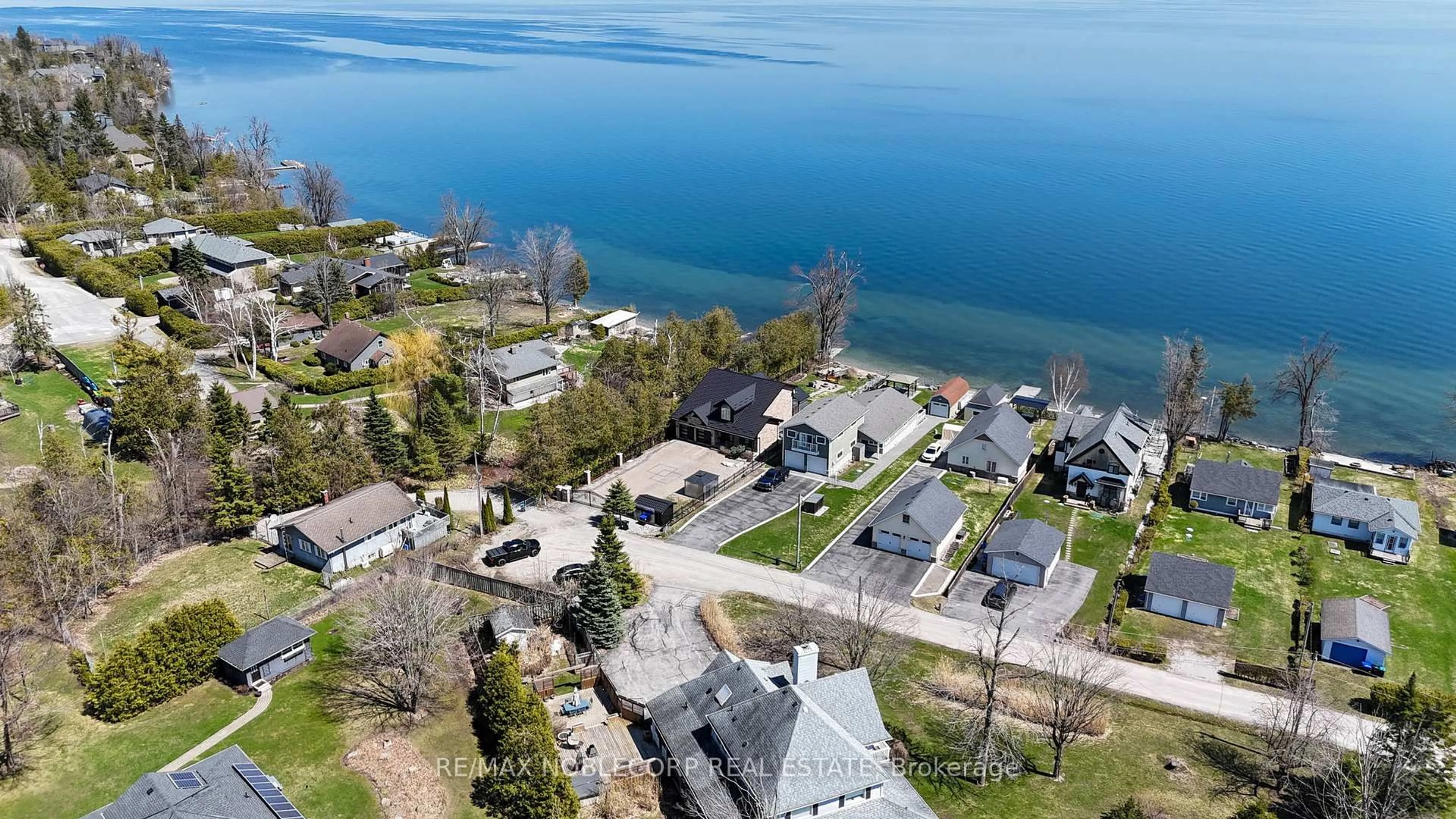 A pic from outside/outdoor area/front of a property/back of a property/a pic from drone, water/lake/river/ocean view for 15 Palm Beach Rd, Oro-Medonte Ontario L0L 1T0