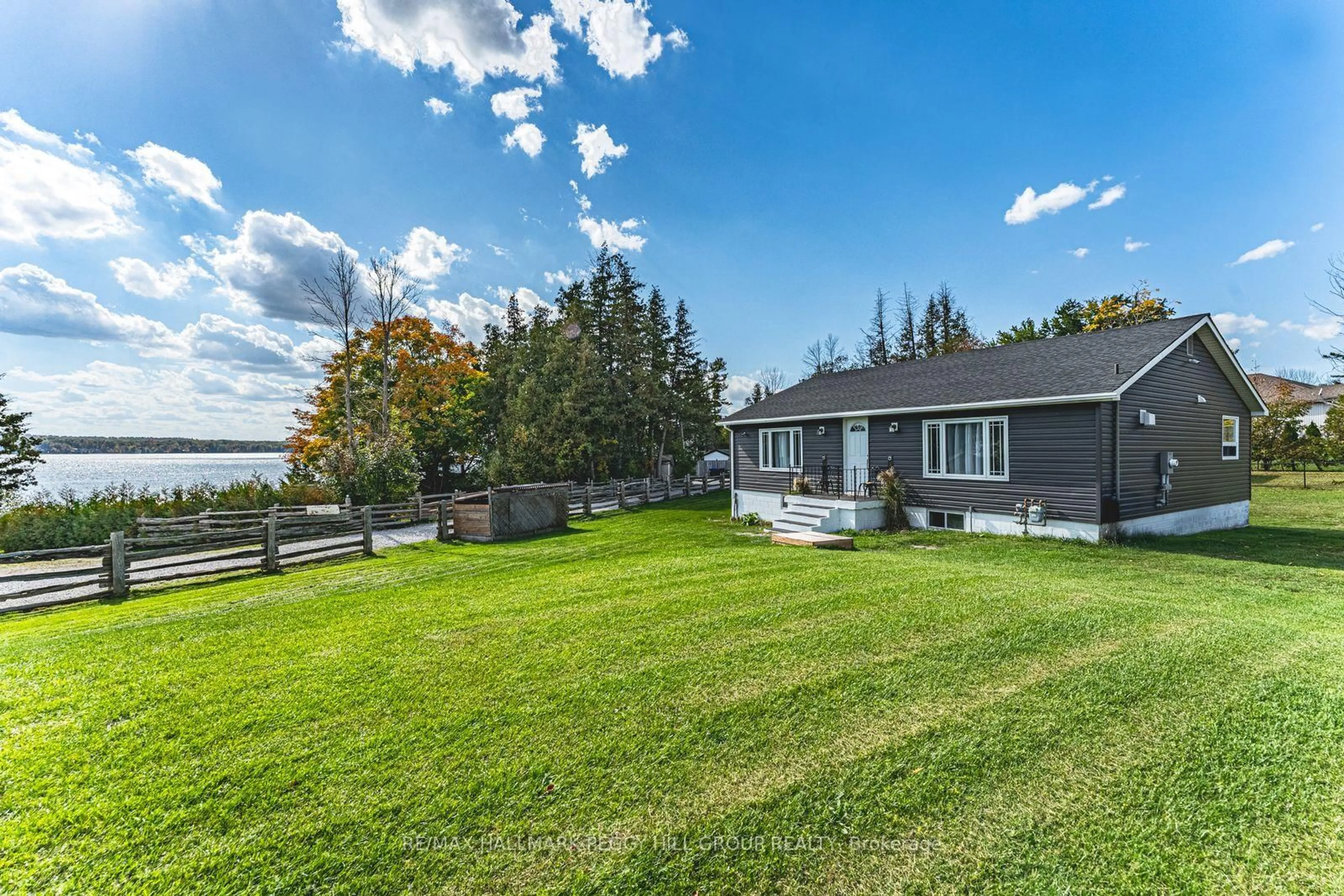 A pic from outside/outdoor area/front of a property/back of a property/a pic from drone, water/lake/river/ocean view for 5724 & 1 Penetanguishene Road & Cedar Lane, Springwater Ontario L0L 1P0