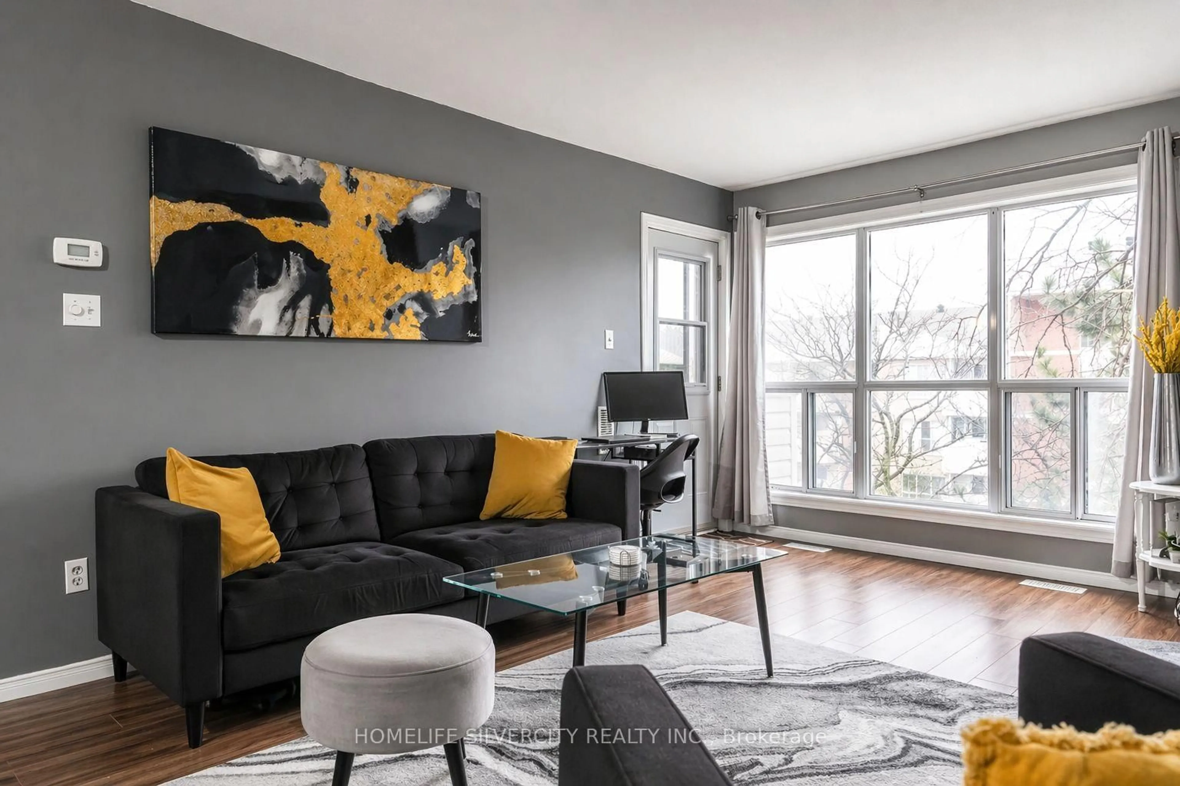 Living room with furniture, unknown for 120 Bell Farm Rd #316, Barrie Ontario L4M 6J2