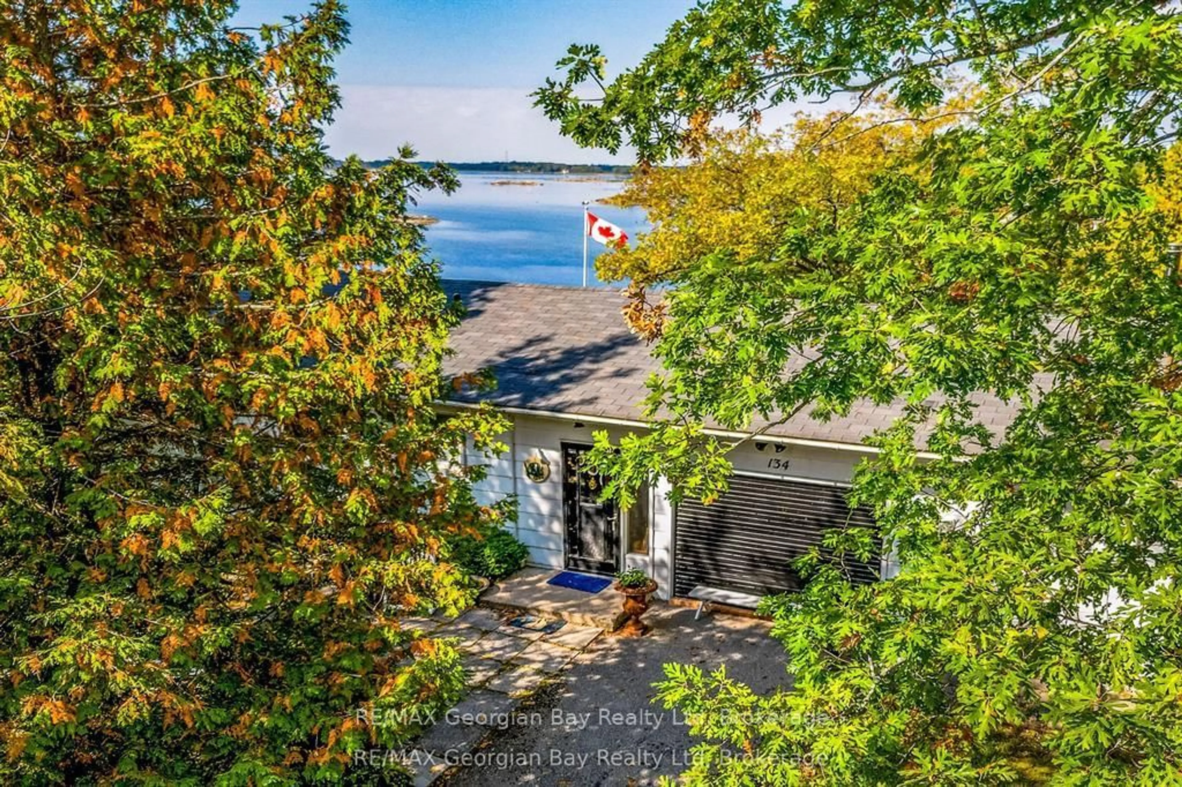 A pic from outside/outdoor area/front of a property/back of a property/a pic from drone, water/lake/river/ocean view for 134 Forest Harbour Pkwy, Tay Ontario L0K 2C0